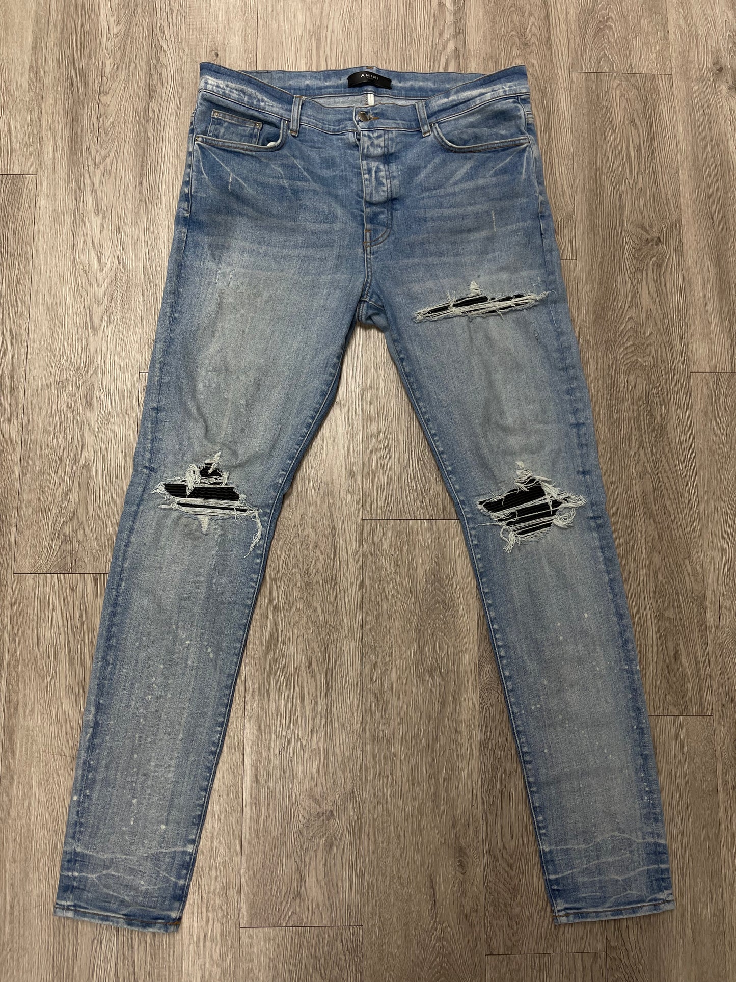 Amiri Mx1 Light Wash Black Patch Jeans