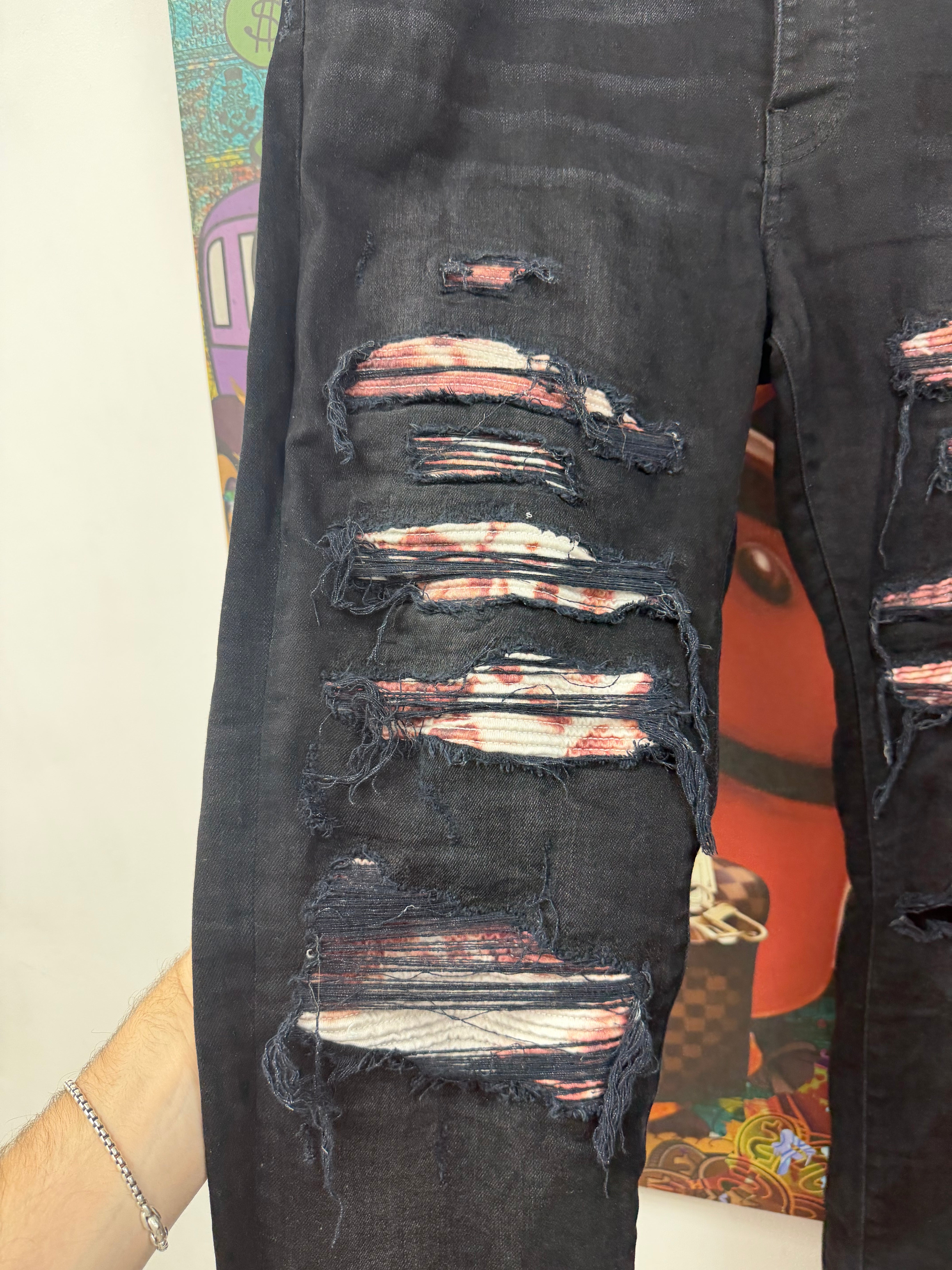 Amiri Black Wash Red Tie Dye Thrasher Patch Jeans
