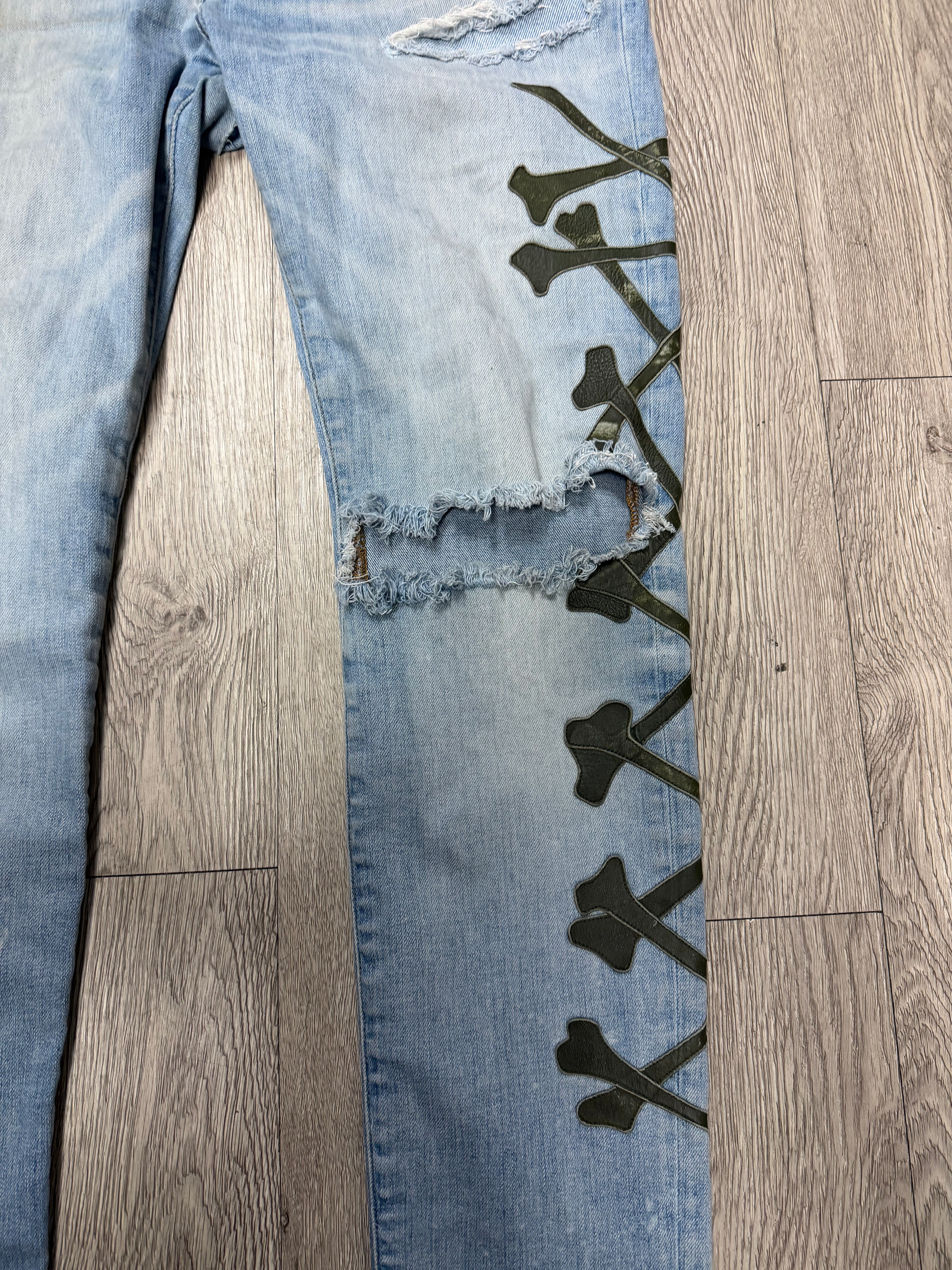 Amiri Light Wash Camo Bones Jeans