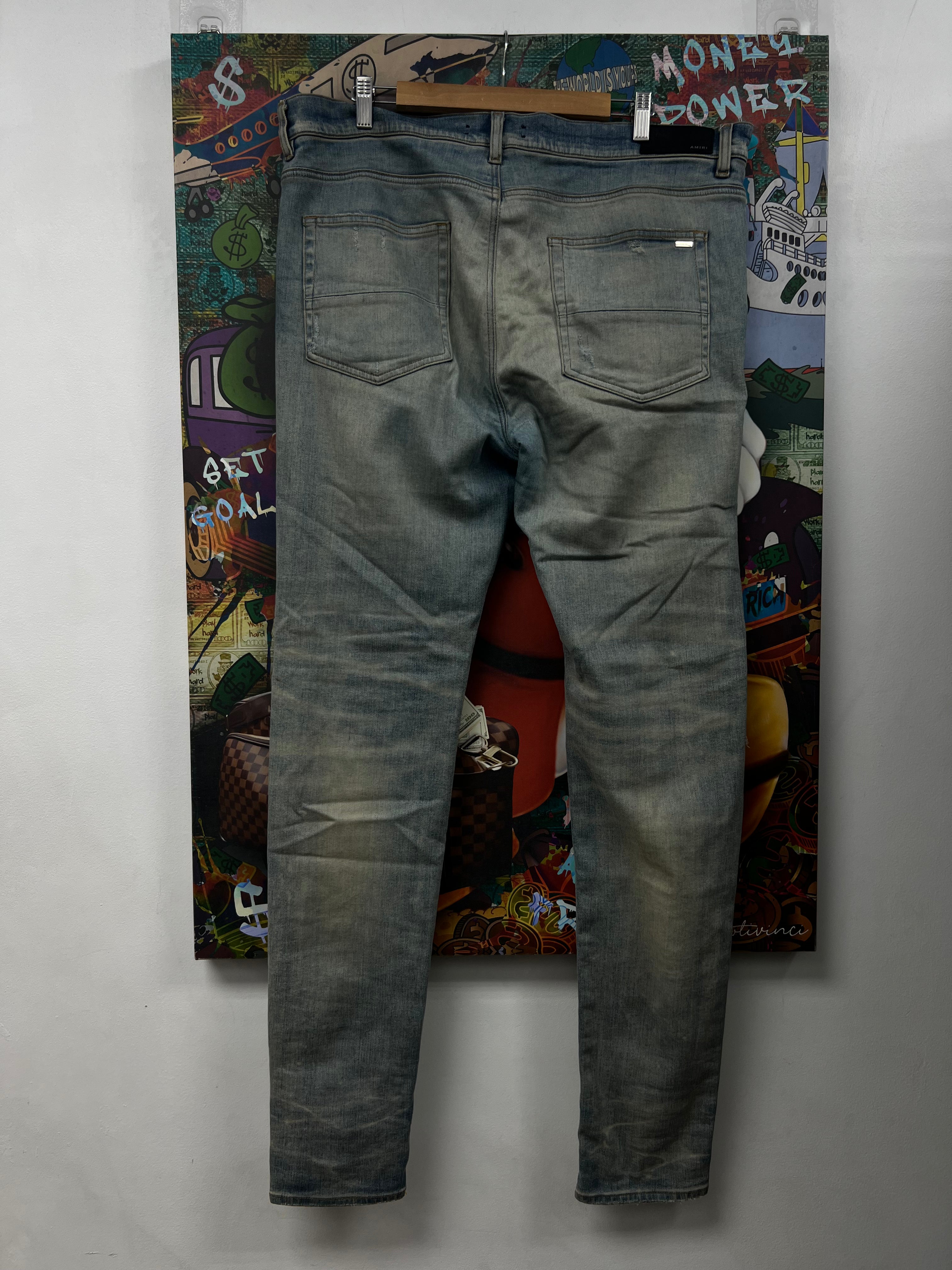 Amiri MX1 Light Wash White Patch Jeans