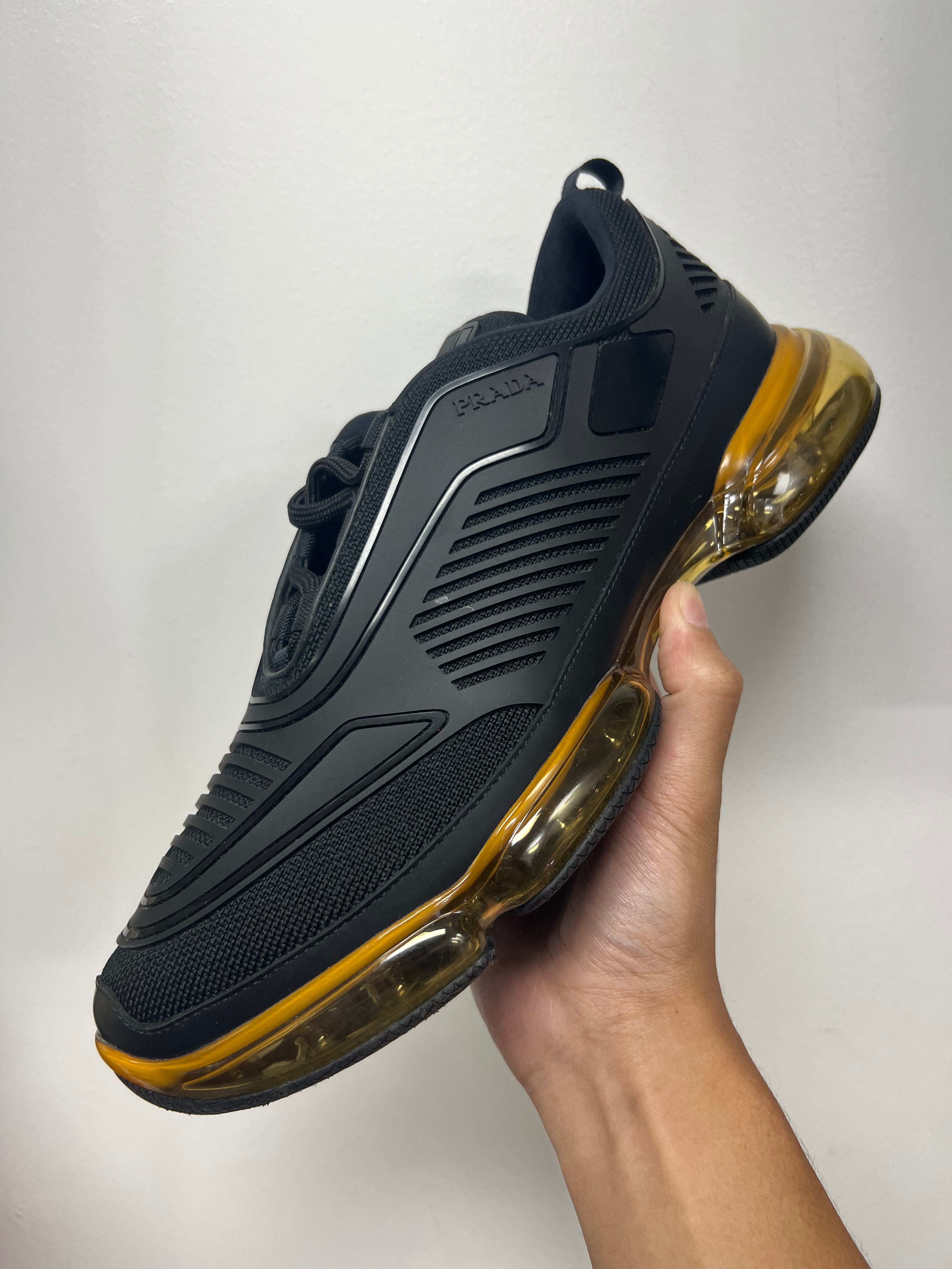 Prada Black Gold Cloudbust Sneakers
