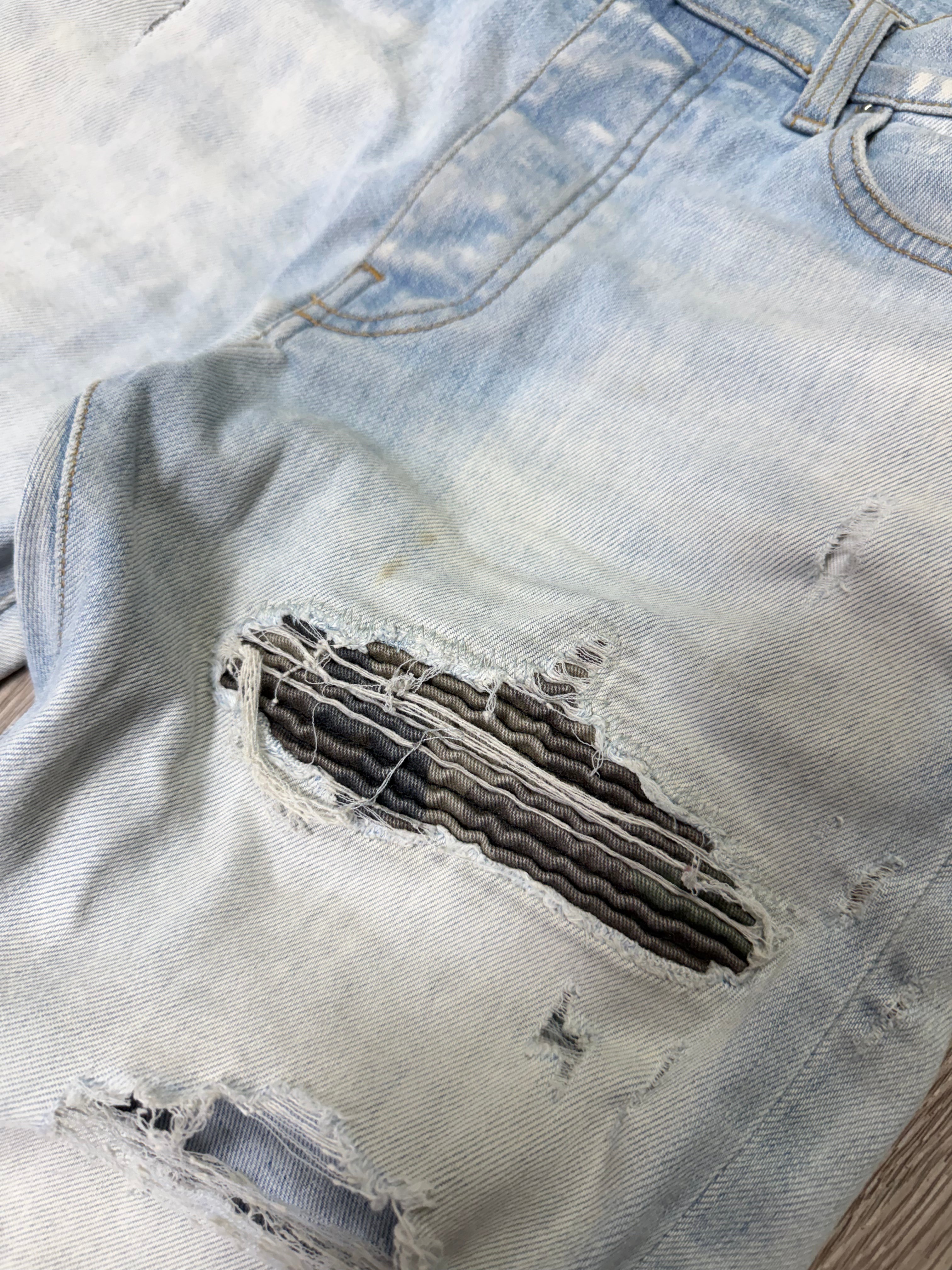 Amiri MX1 Light Wash Camo Patch Jeans