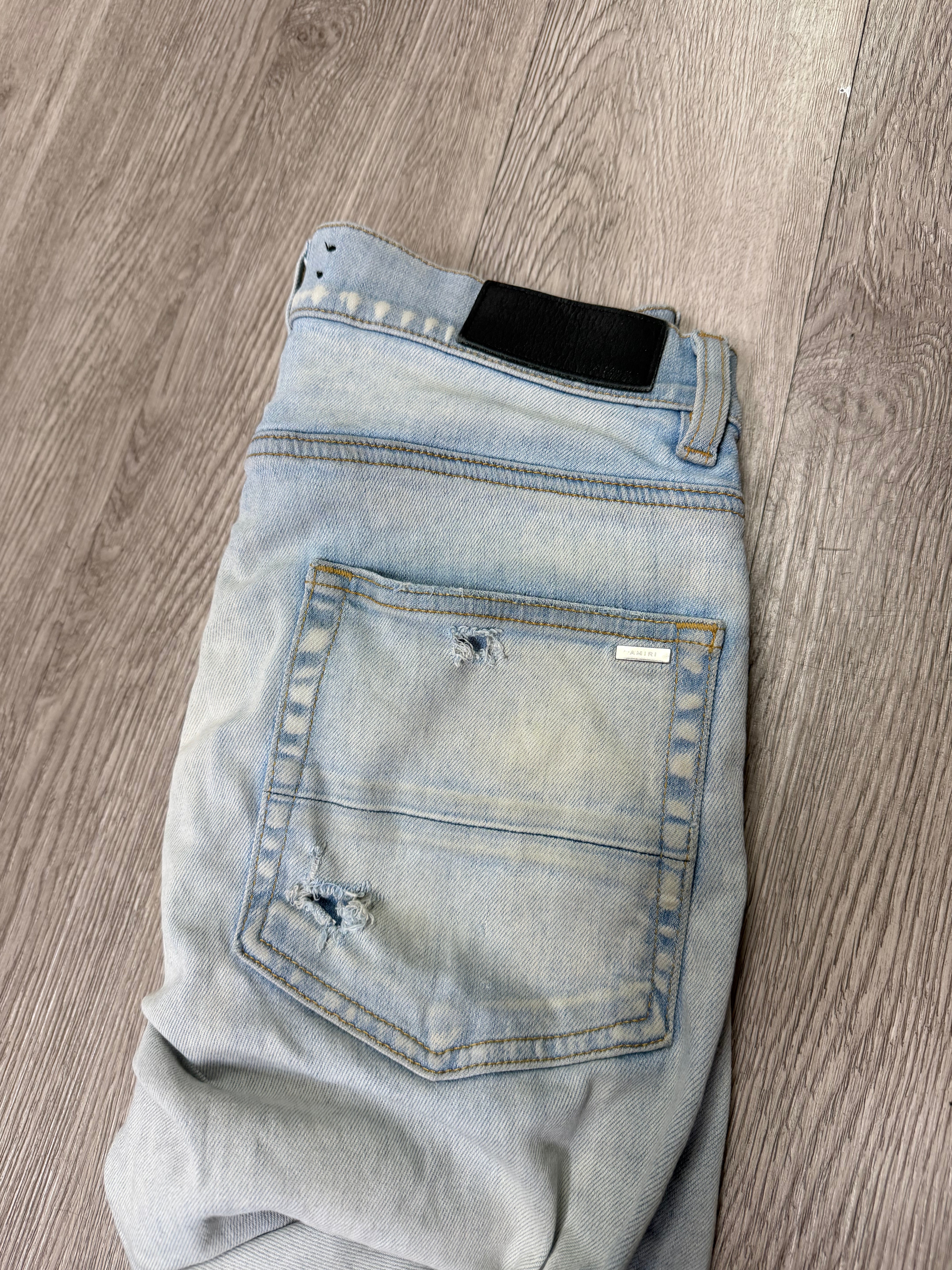 Amiri MX1 Light Wash Camo Patch Jeans