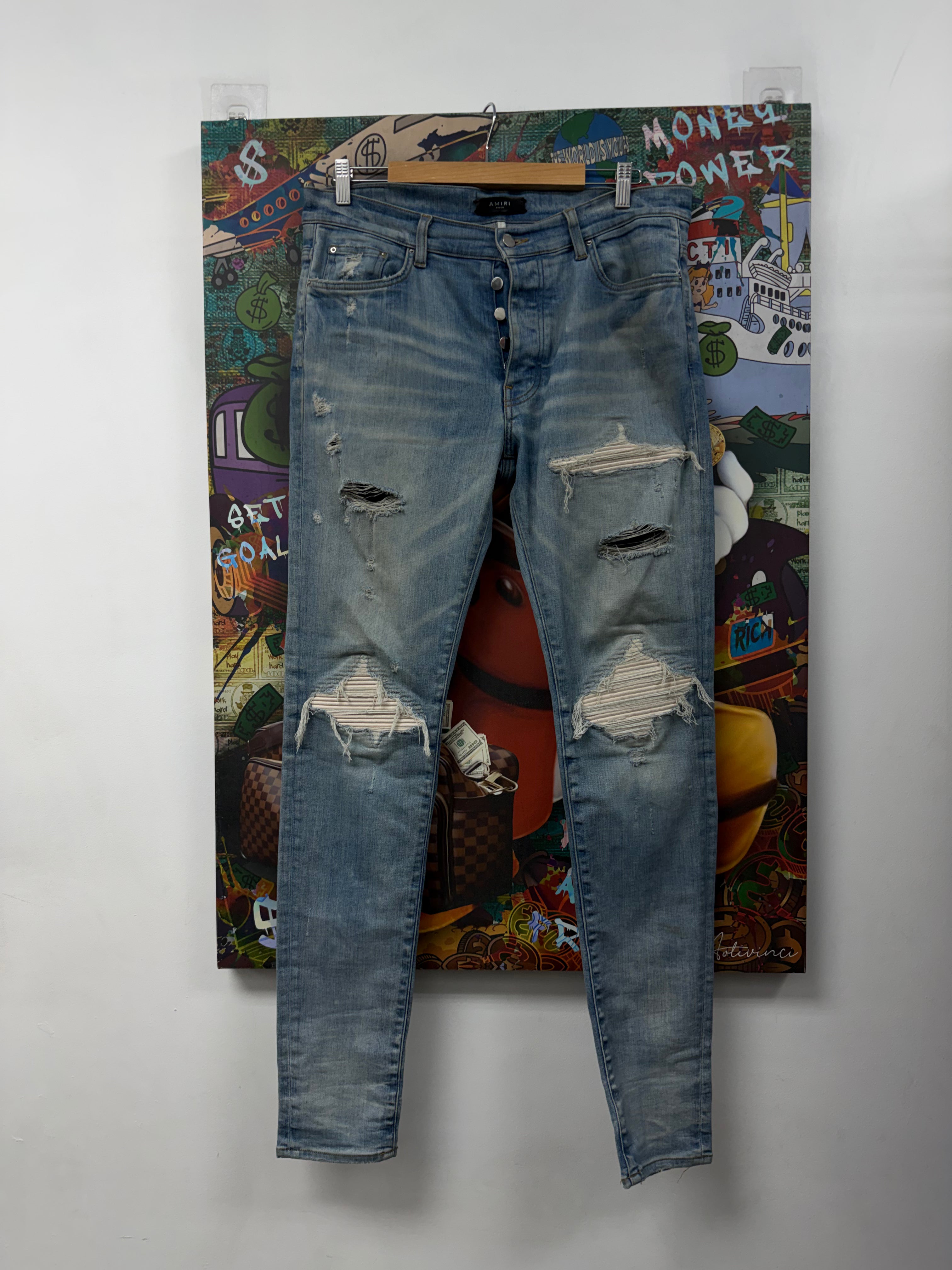 Amiri MX1 Light Wash White Suede Patch Jeans