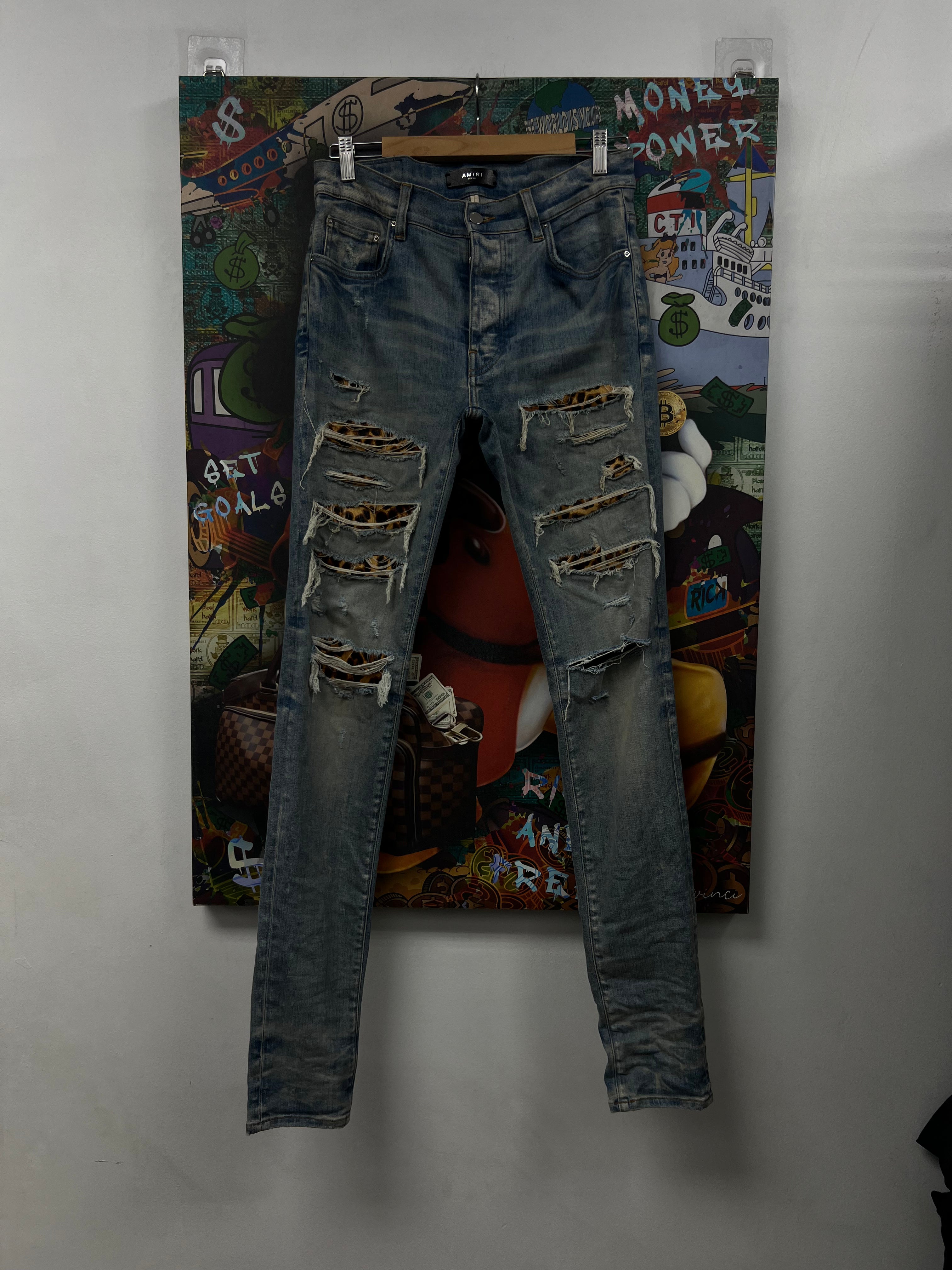 Amiri Light Wash Cheetah Thrasher Jeans