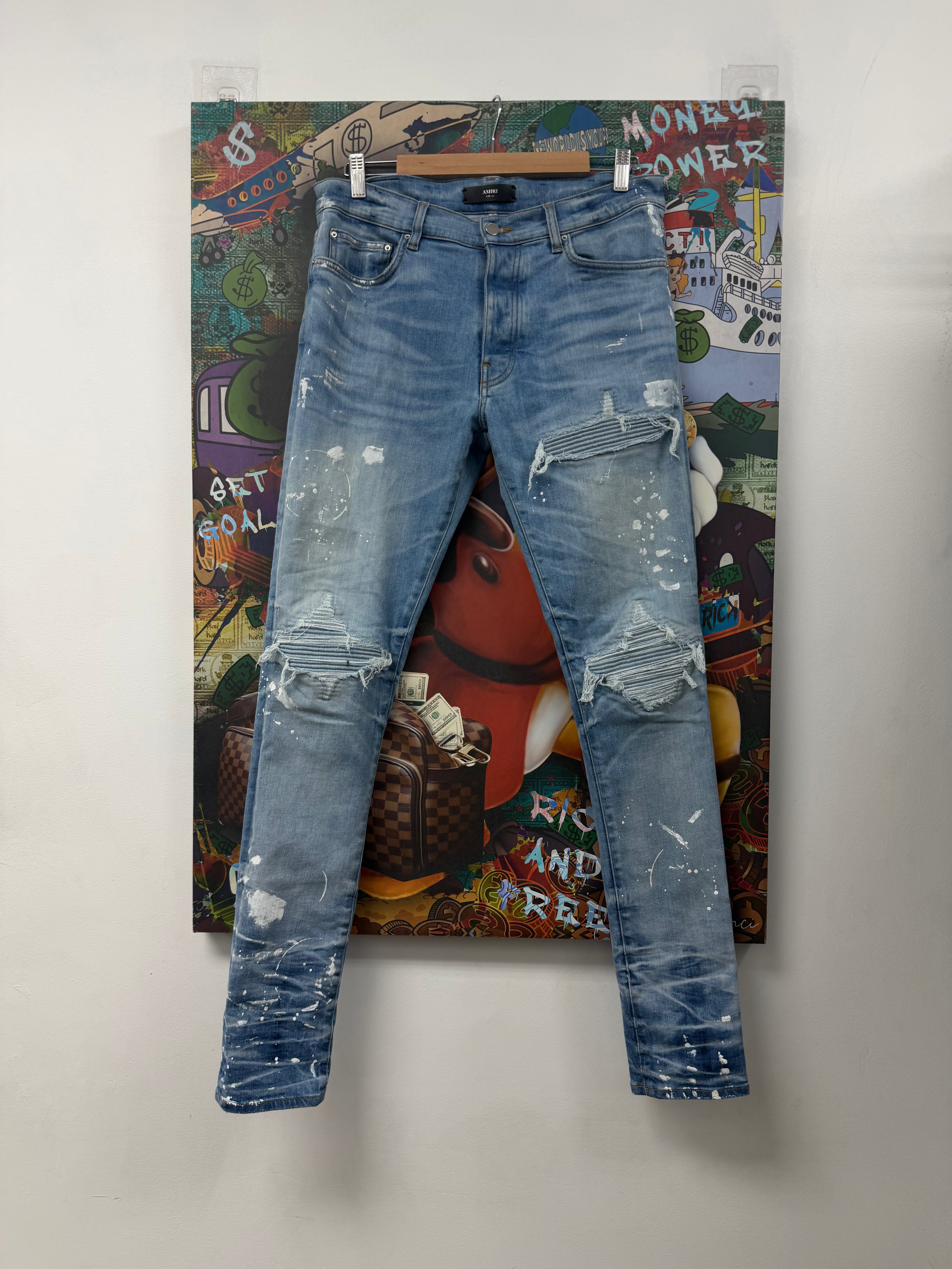 Amiri MX1 Light Wash Denim Splatter Patch Jeans