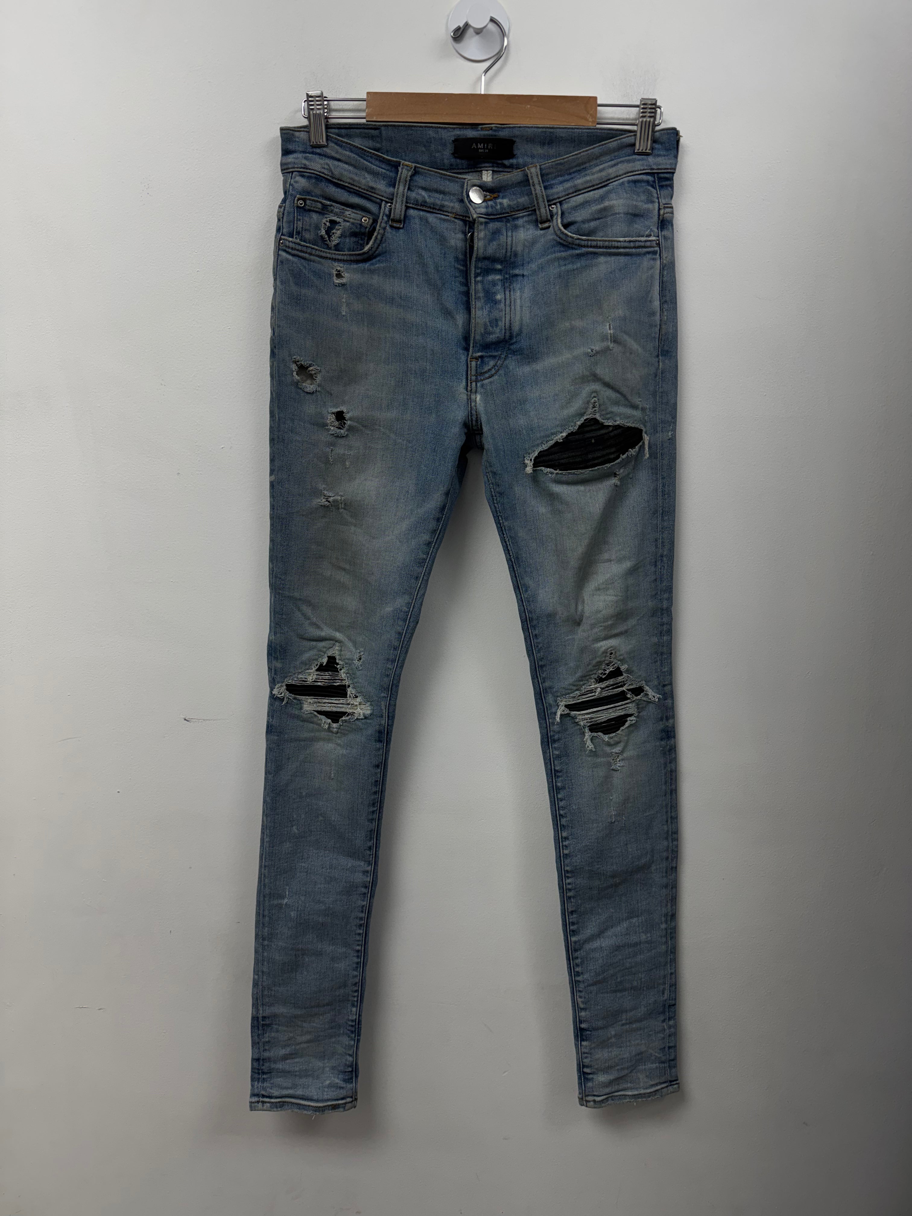 Amiri MX1 Light Wash Black Leather Patch Jeans