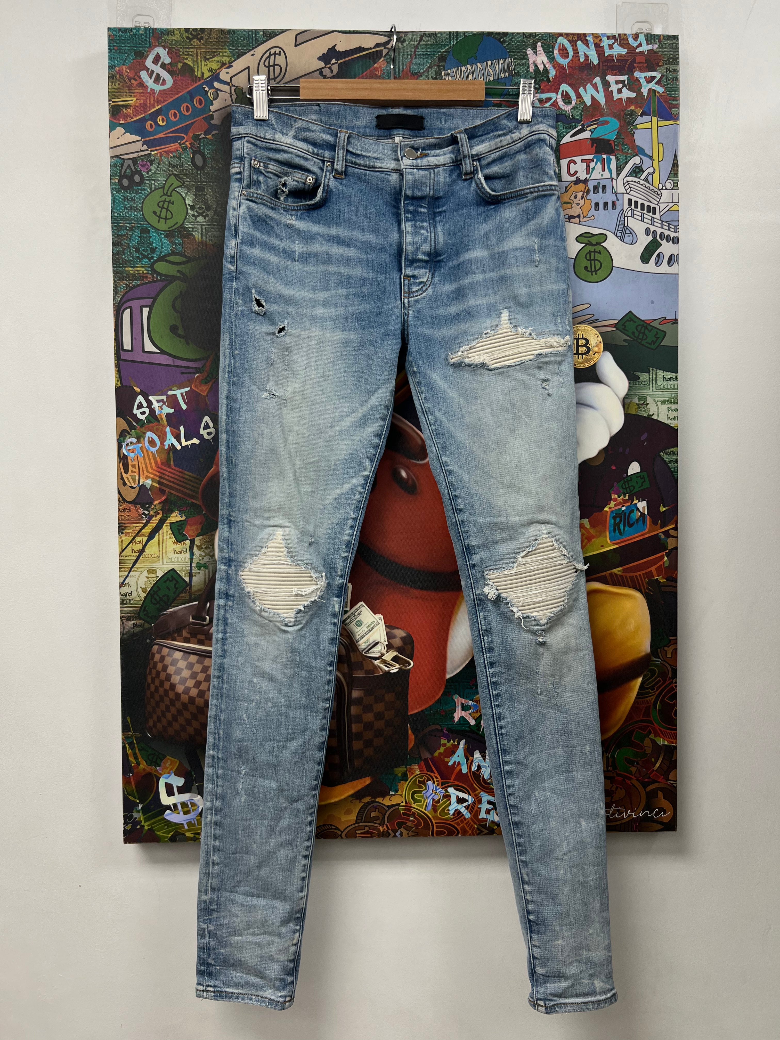 Amiri MX1 Light Wash White Patch Jeans
