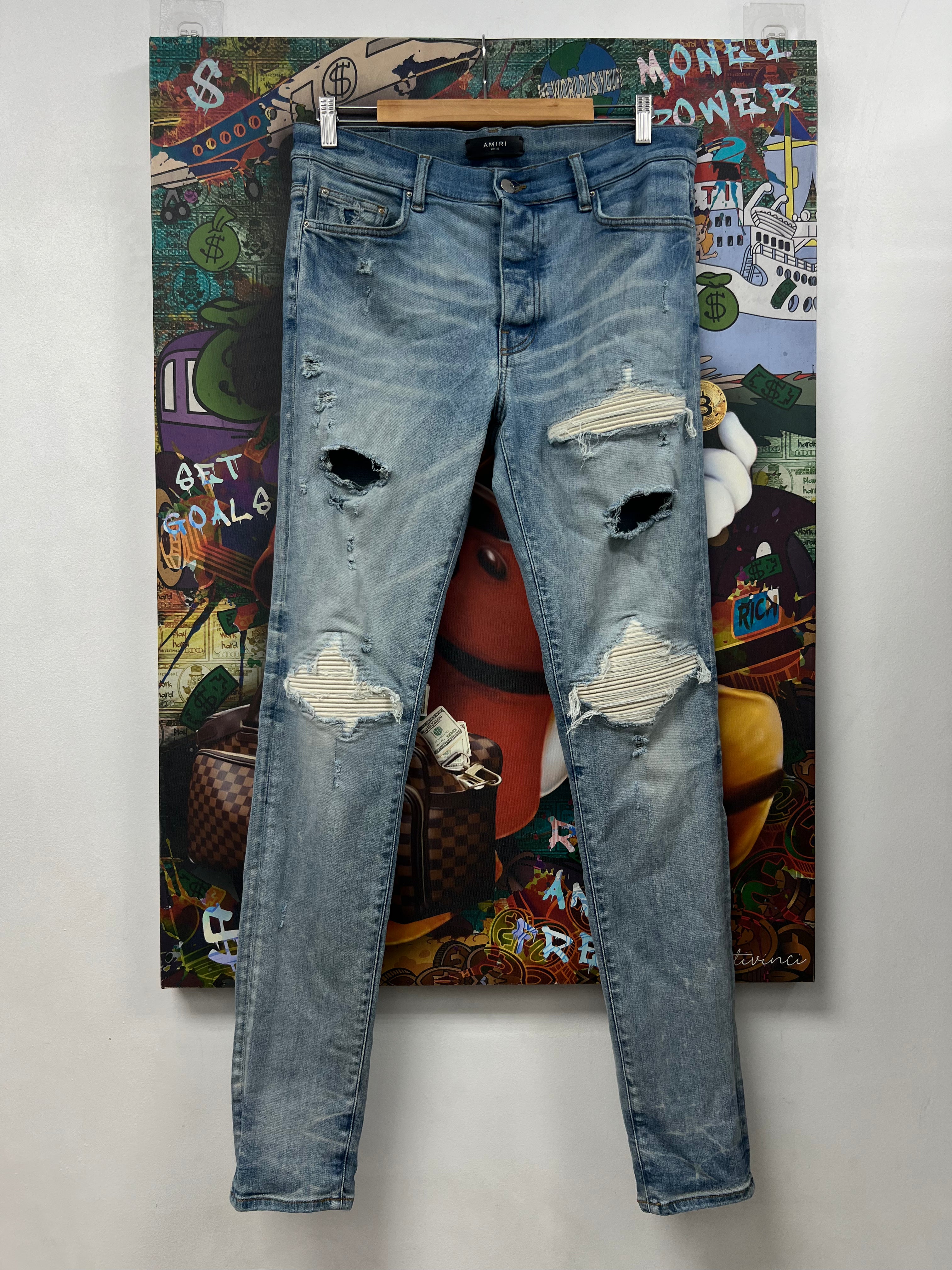 Amiri MX1 Light Wash White Patch Jeans