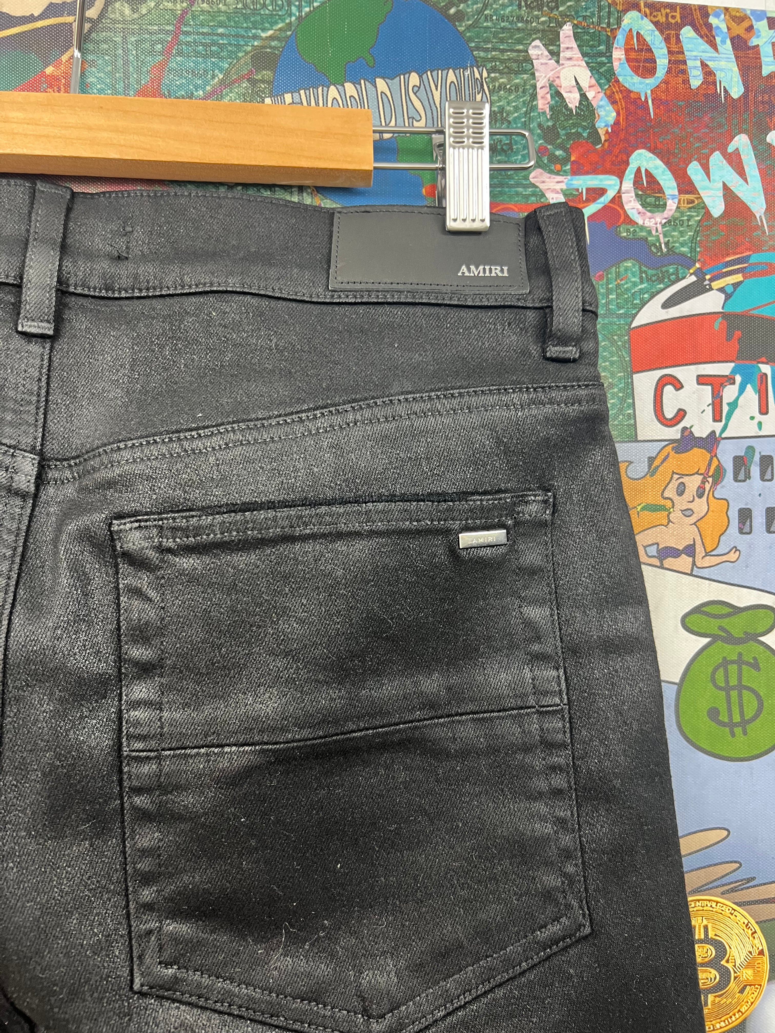 Amiri Black Wax Staggered Logo Jeans