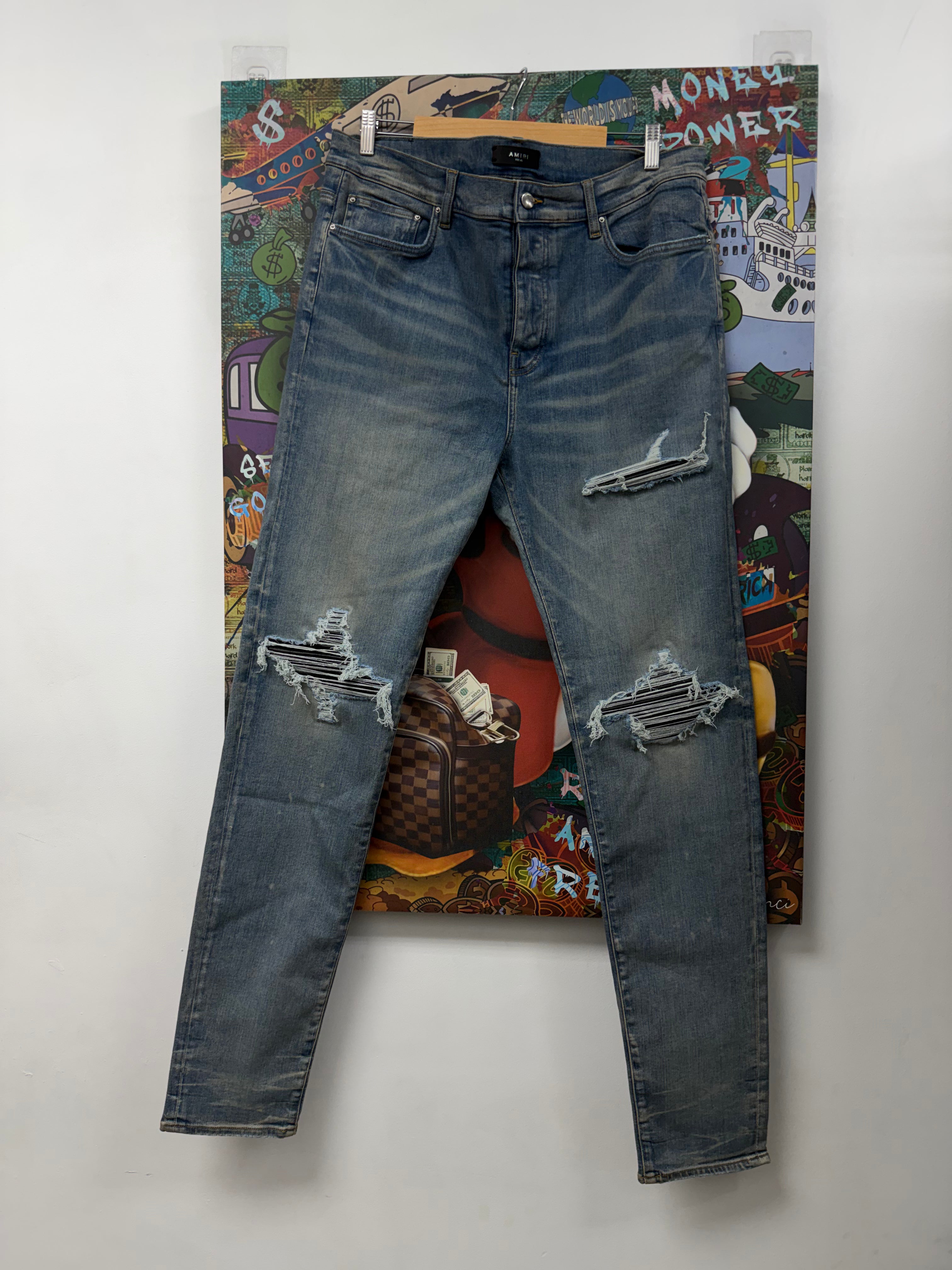 Amiri MX1 Light Wash Black Patch Jeans