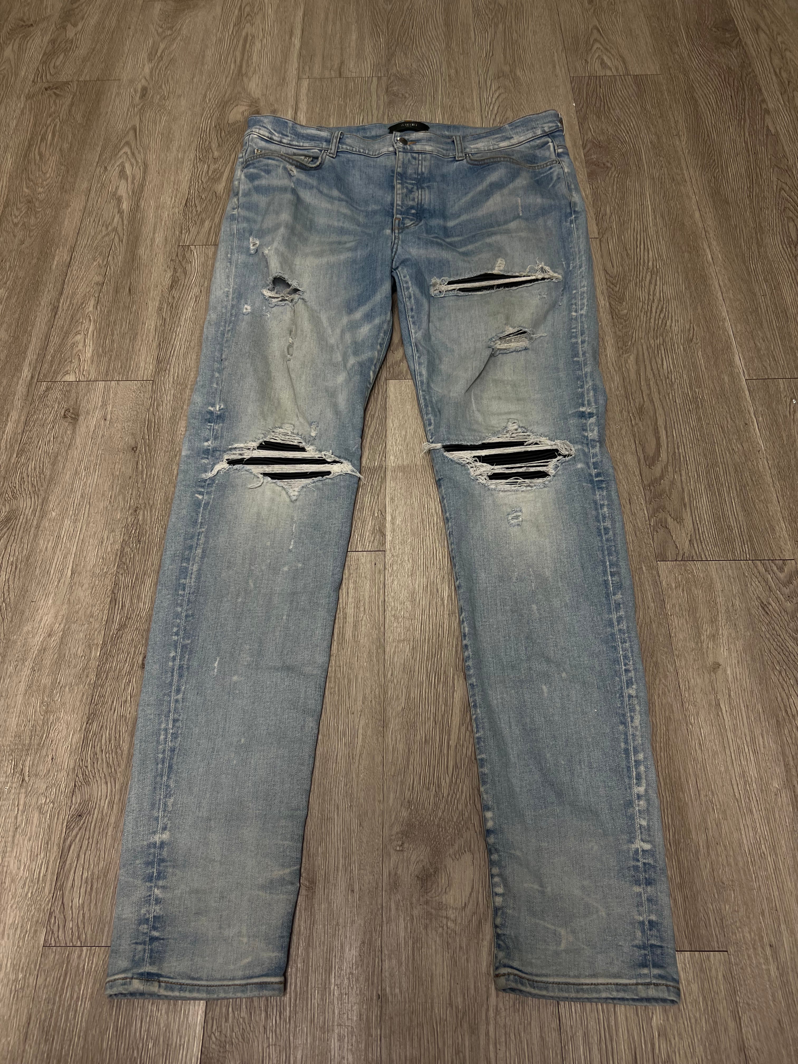 Amiri MX1 Light Wash Black Leather Patch Jeans