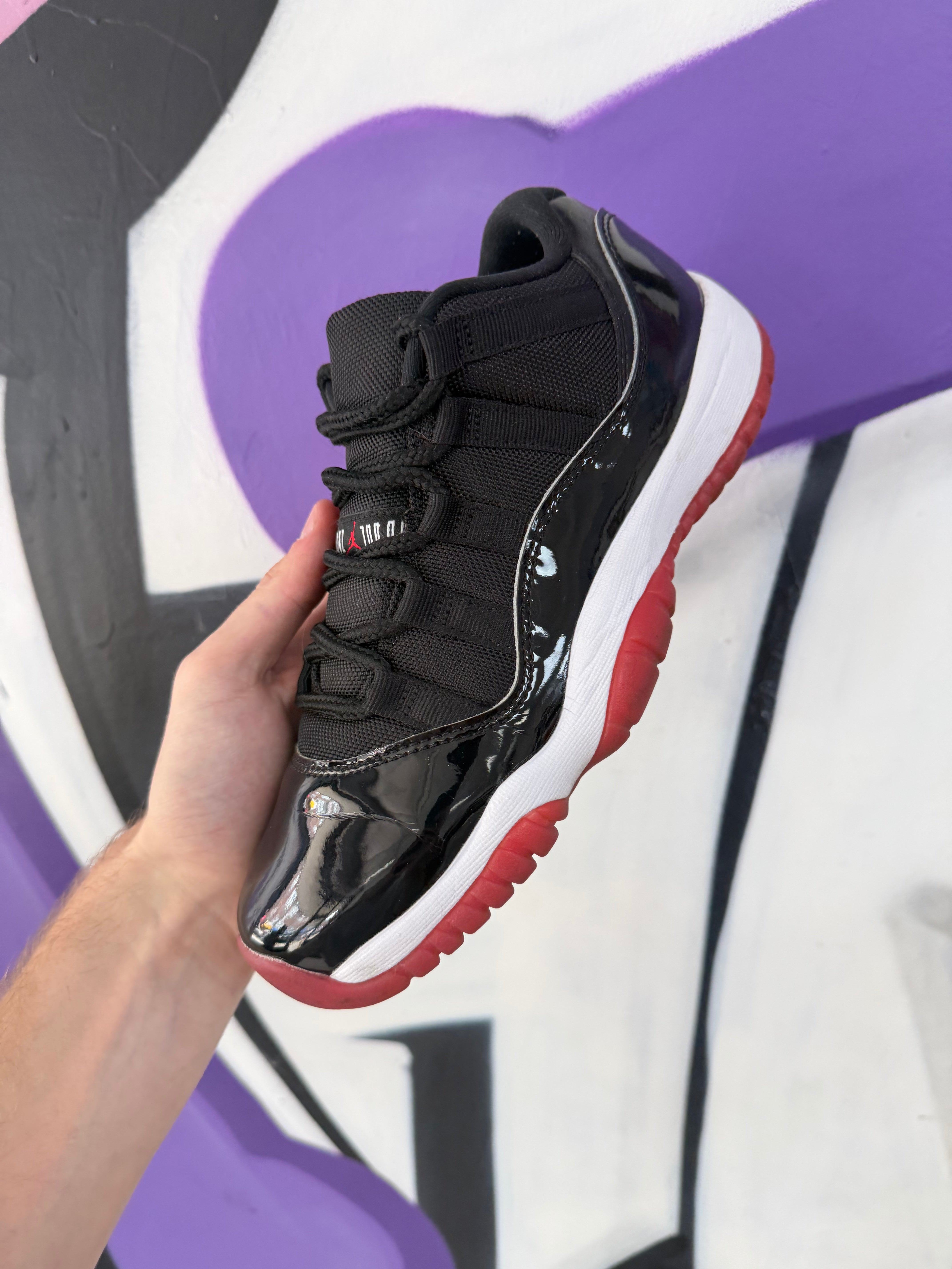 Jordan 11 Low Bred Sneakers