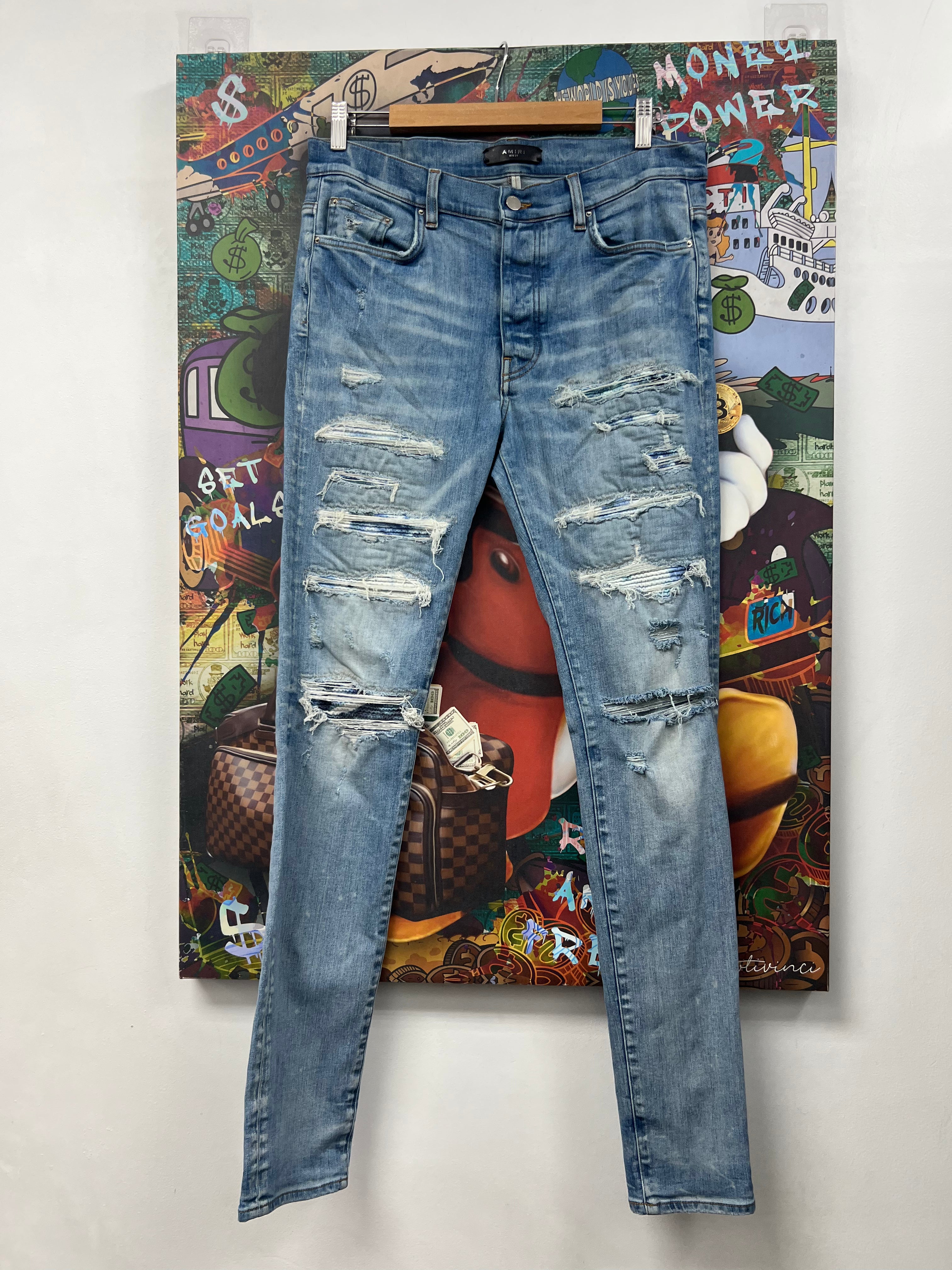 Amiri Light Wash Blue Tie Dye Thrasher Patch Jeans