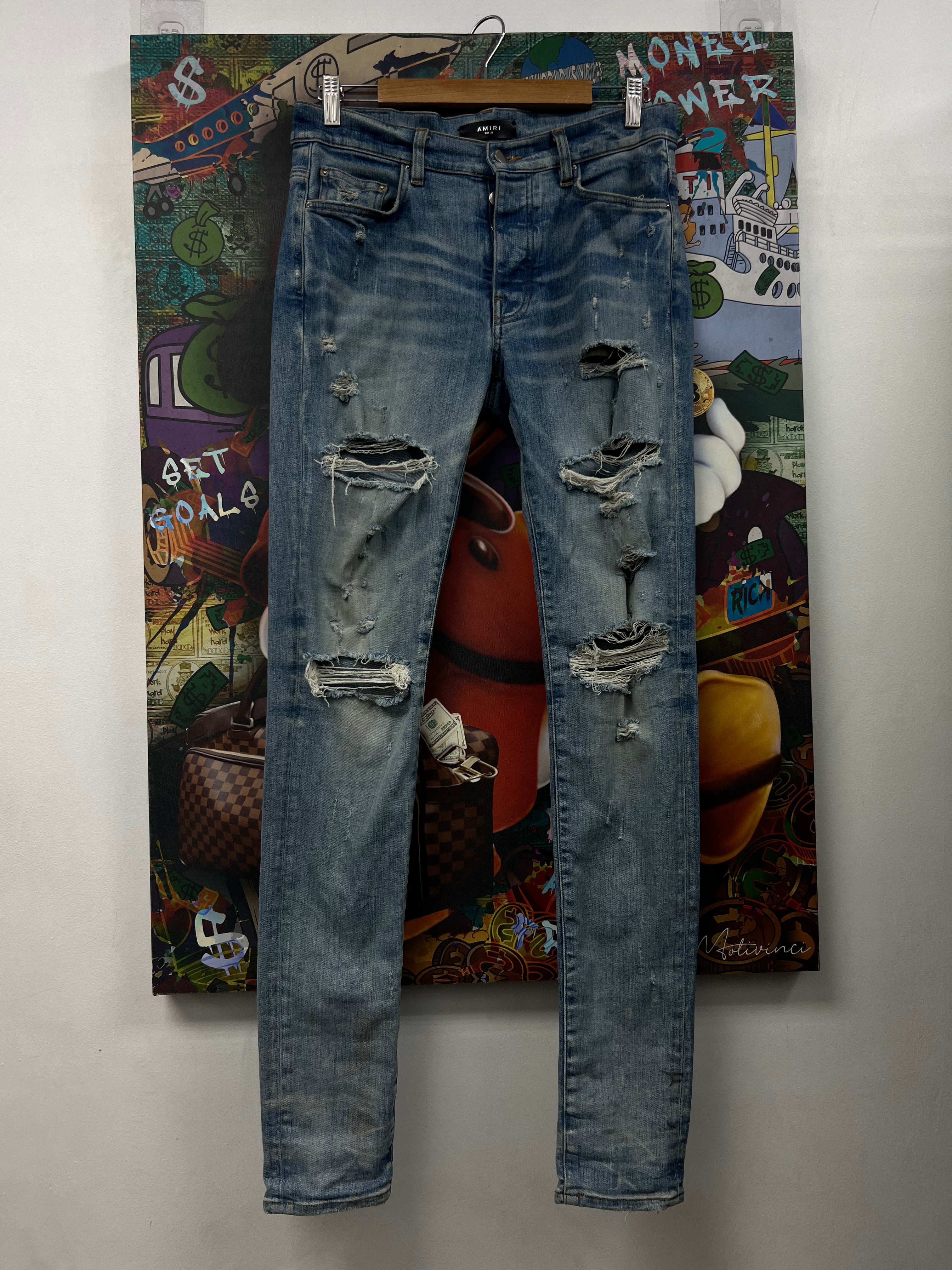 Amiri Light Wash Ripped Thrasher Patch Jeans