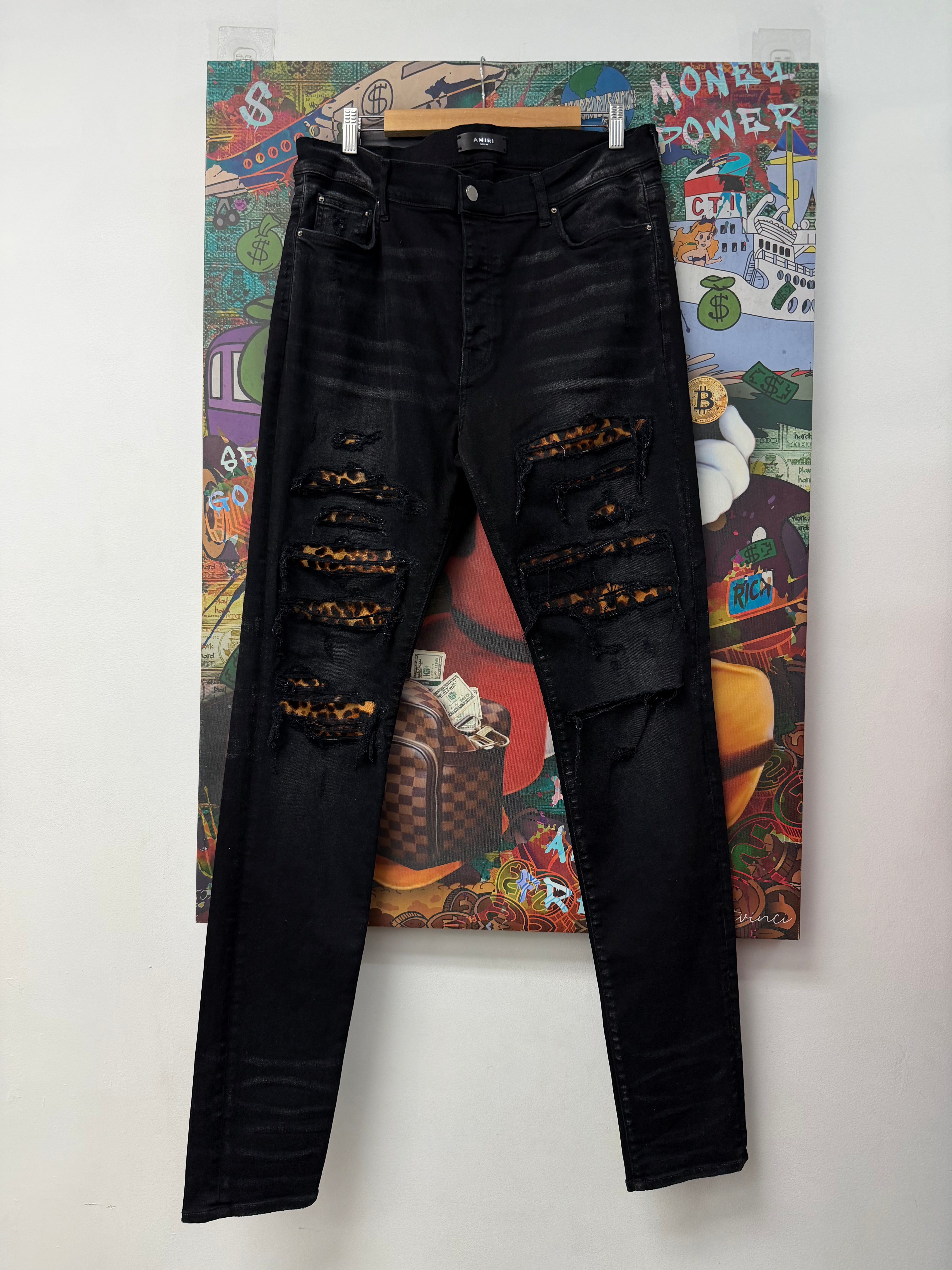 Amiri Black Wash Cheetah Thrasher Patch Jeans
