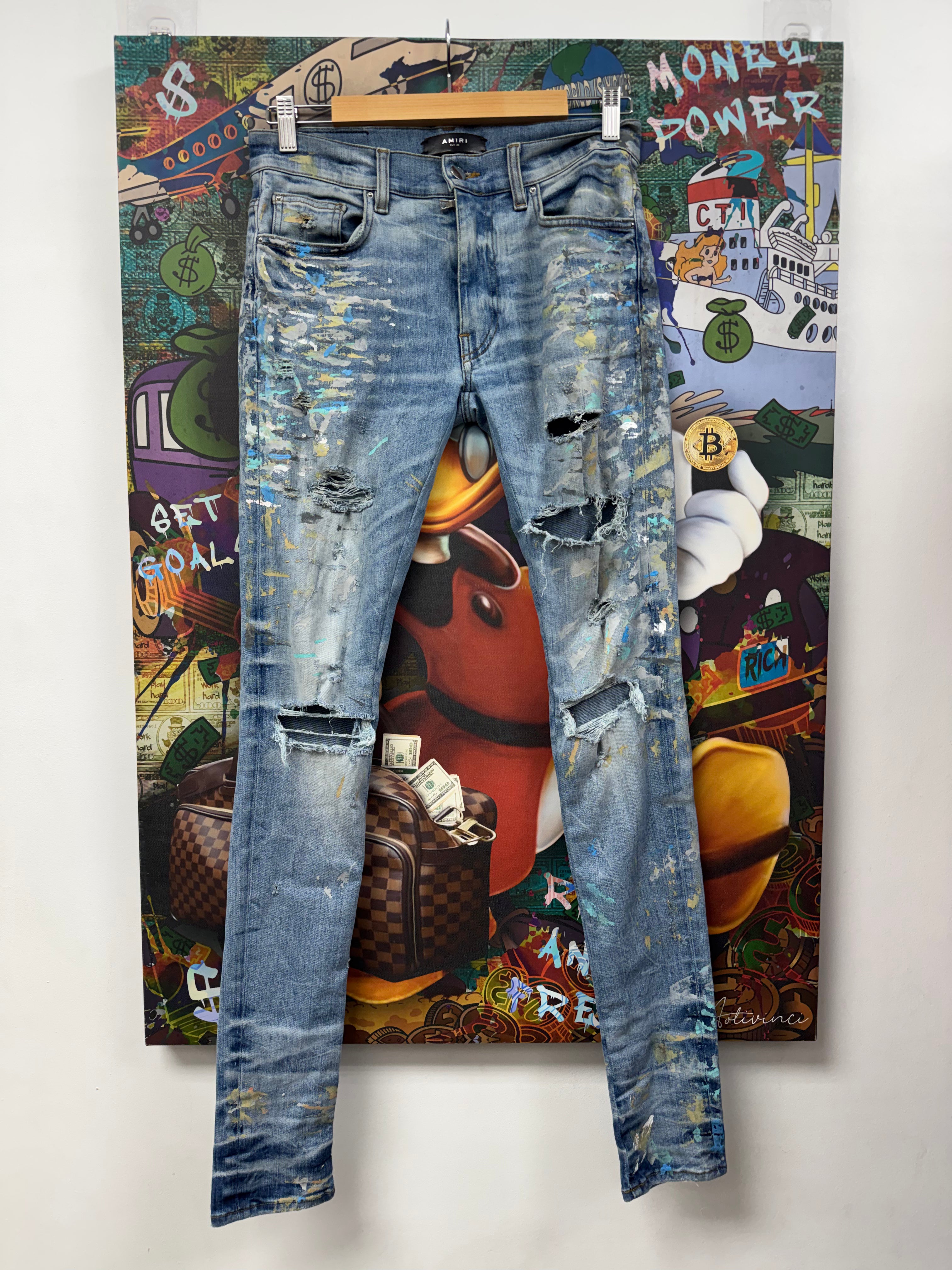 Amiri Light Wash Paint Splatter Knee Rip Jeans