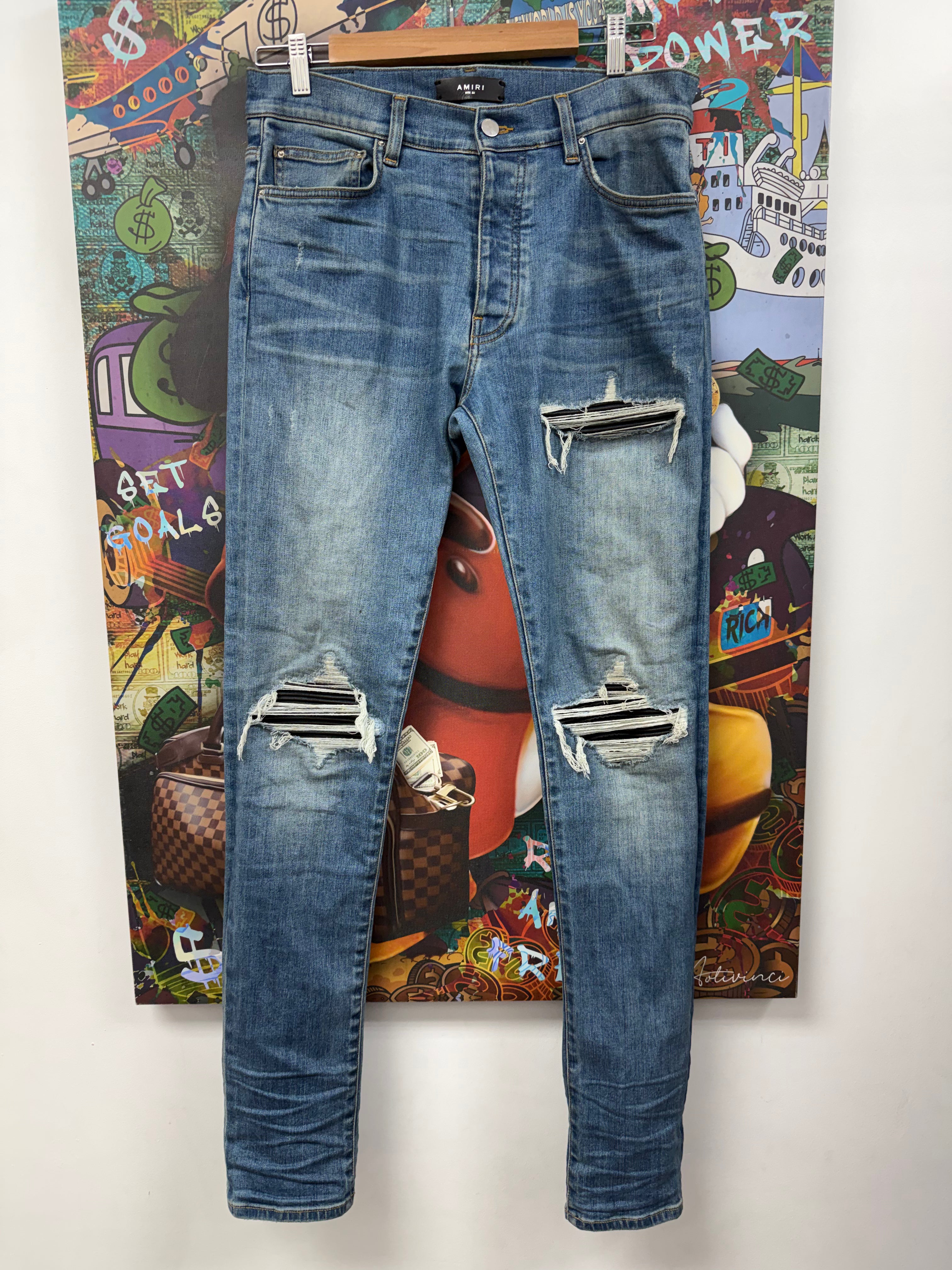 Amiri MX1 Light Wash Black Patch Jeans