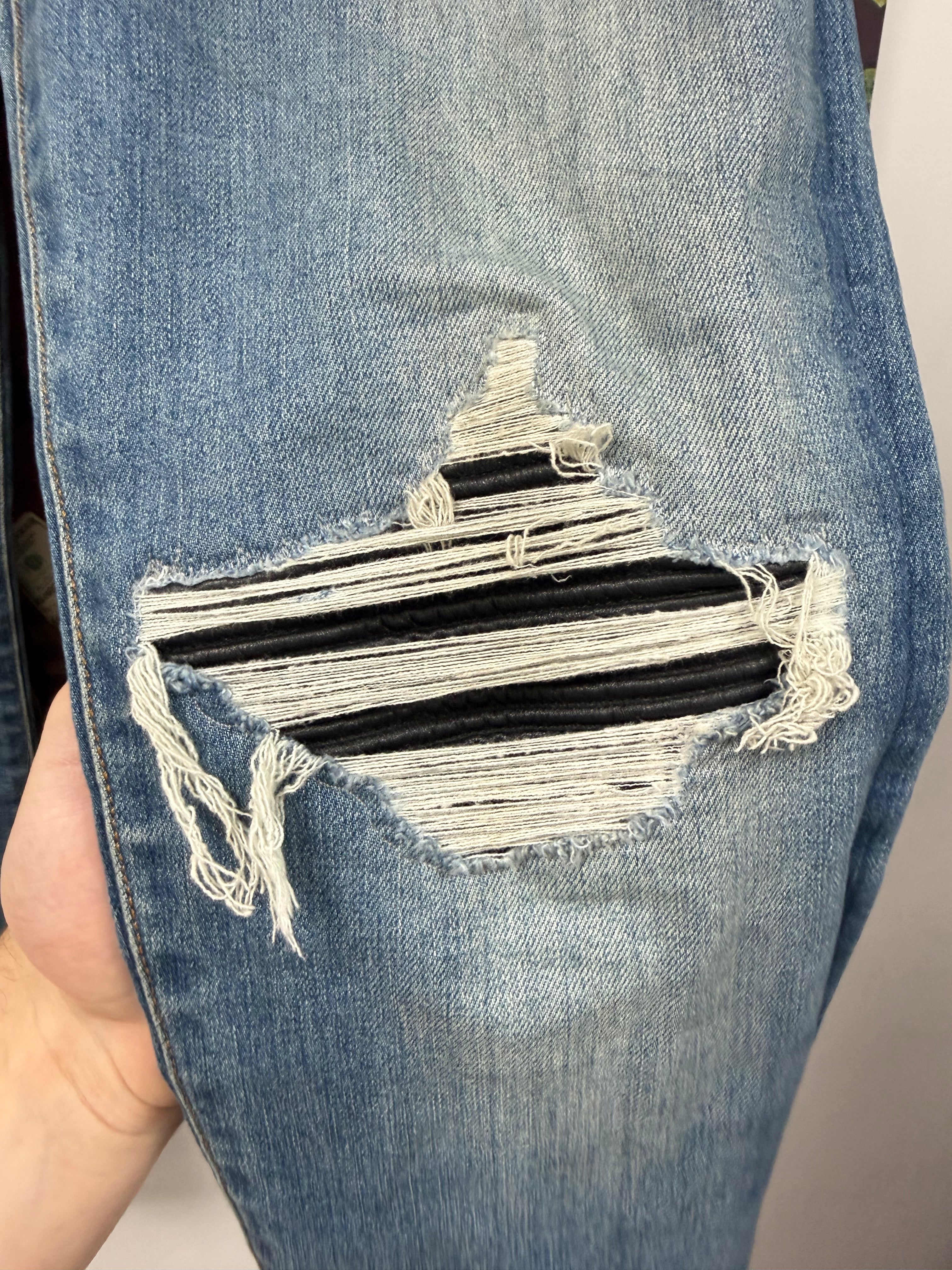 Amiri MX1 Light Wash Black Patch Jeans