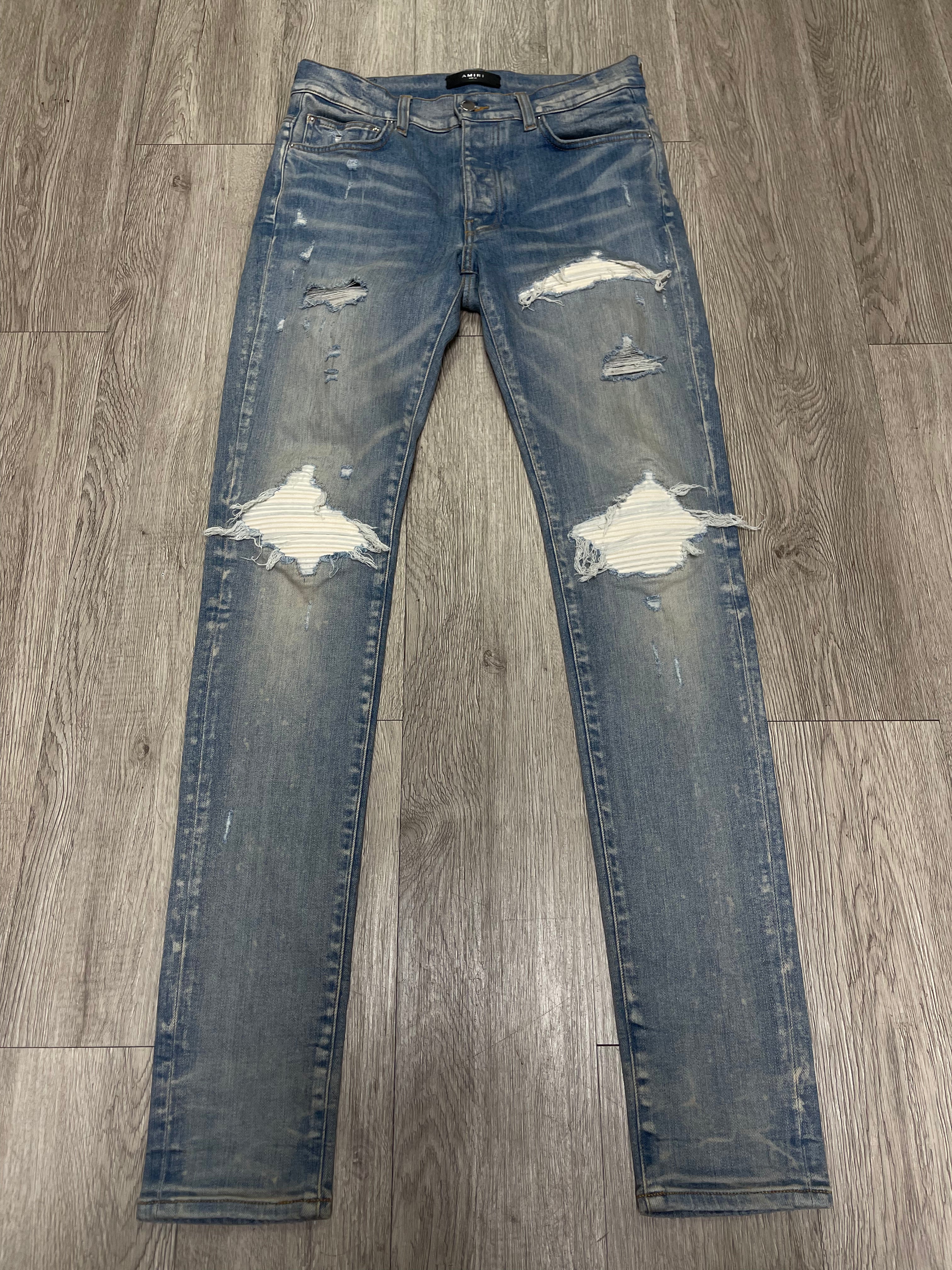 Amiri MX1 Light Wash White Patch Jeans