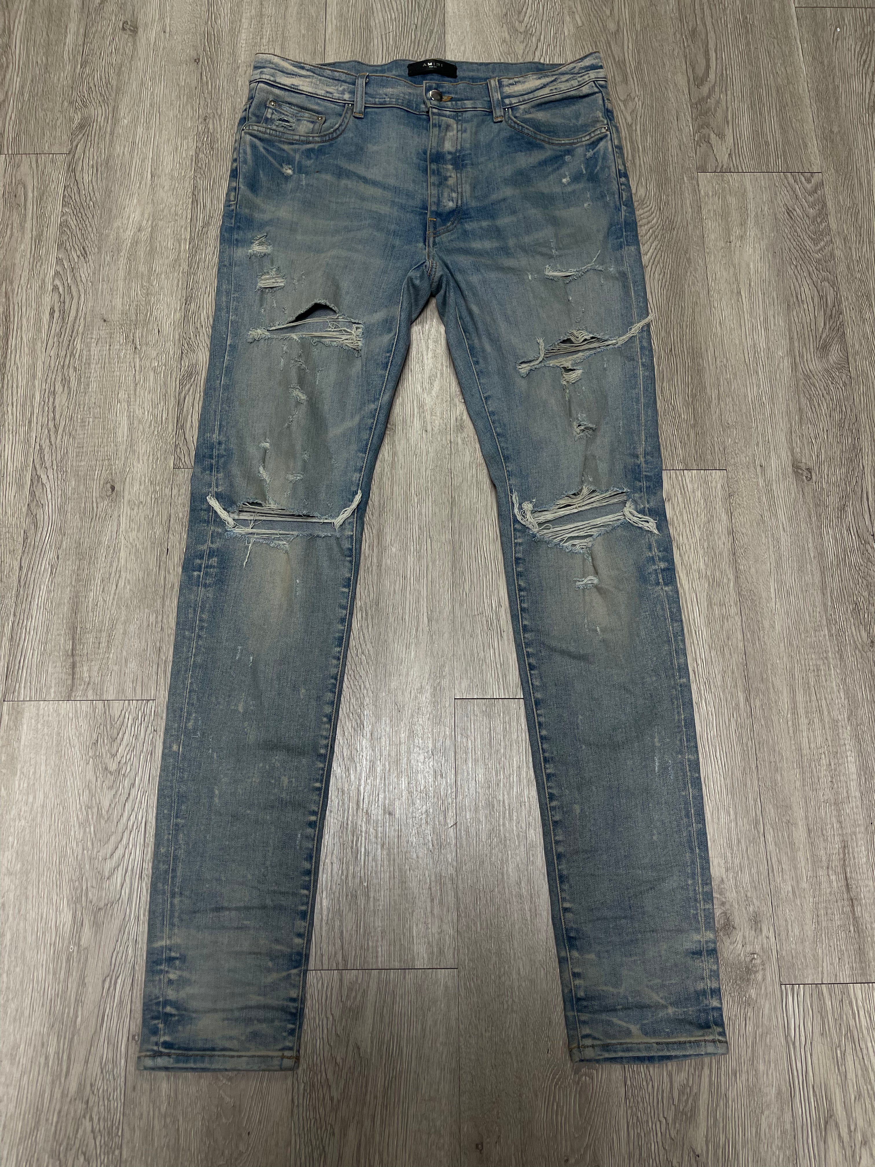 Amiri Light Indigo Ripped Thrasher Jeans