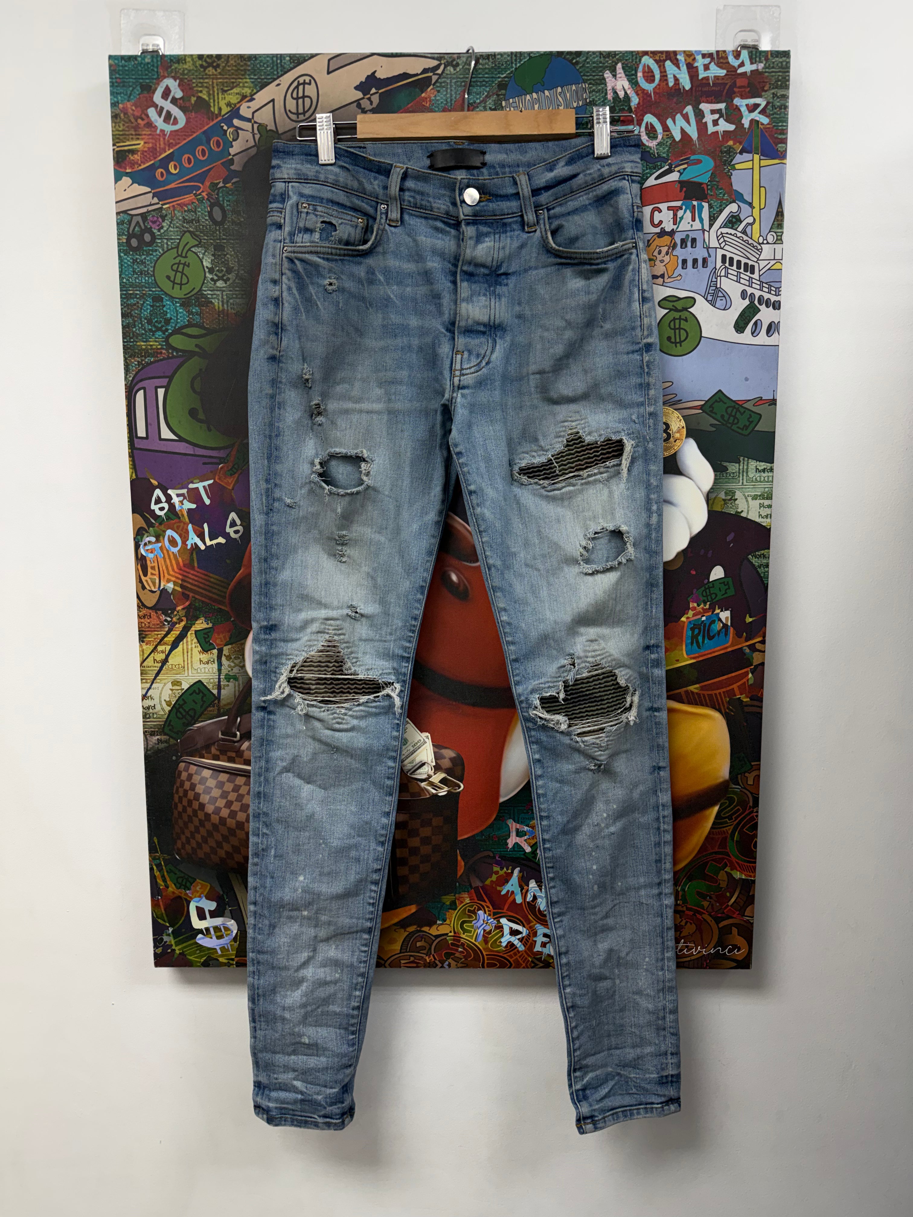 Amiri MX1 Light Wash Camo Patch Jeans