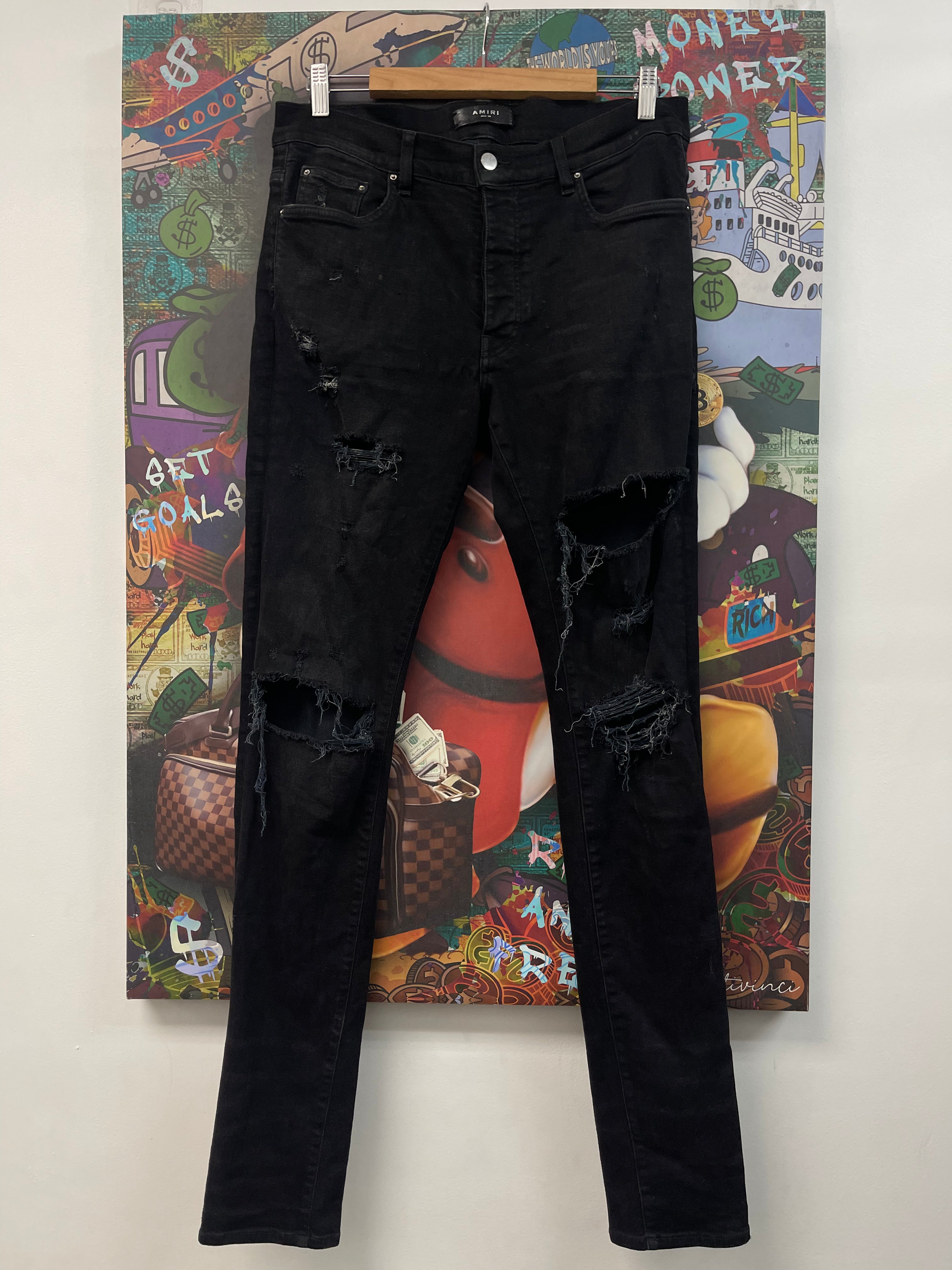 Amiri Black Knee Rip Thrasher Jeans