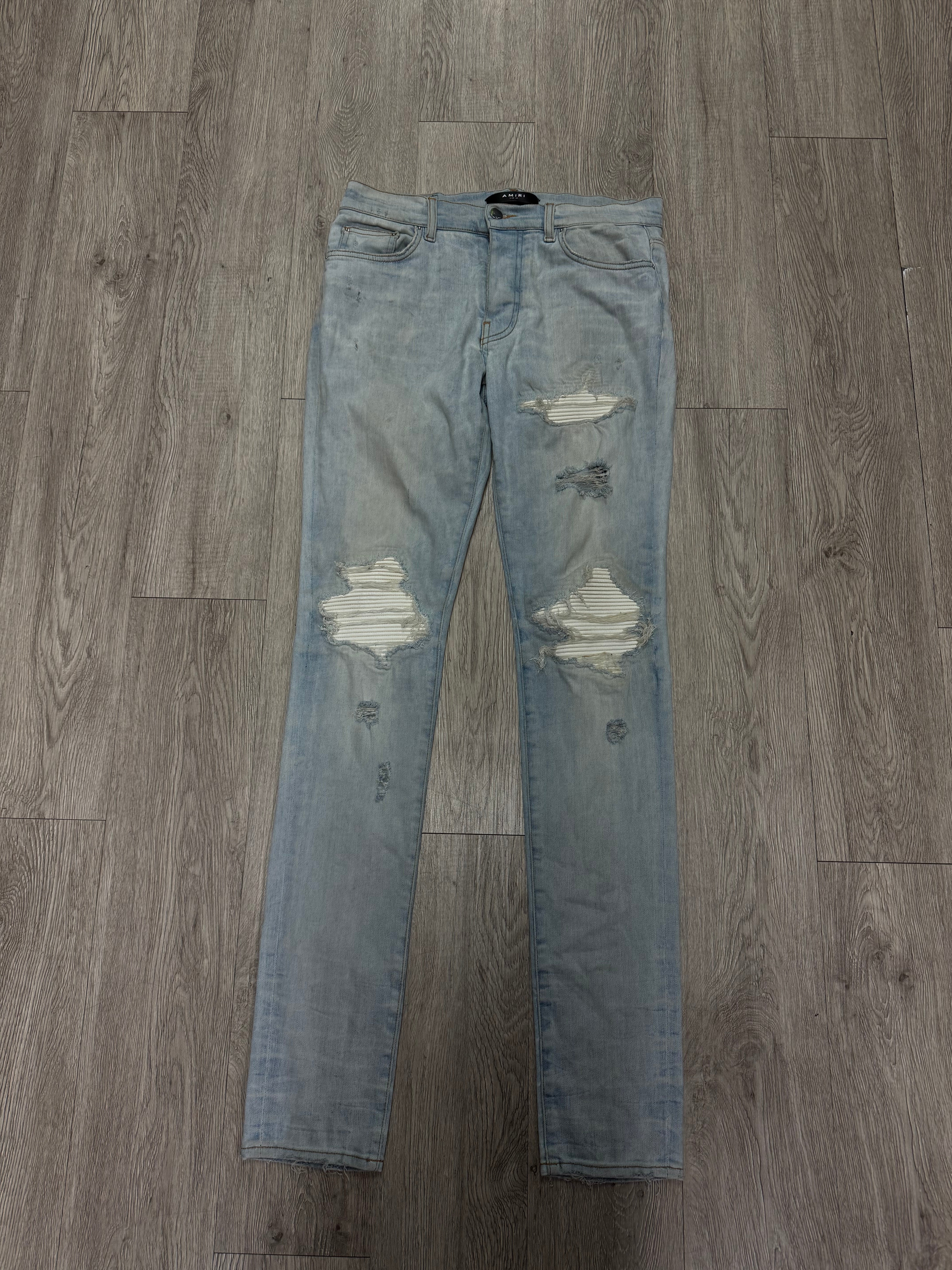 Amiri Mx1 Light Wash White Patch Jeans