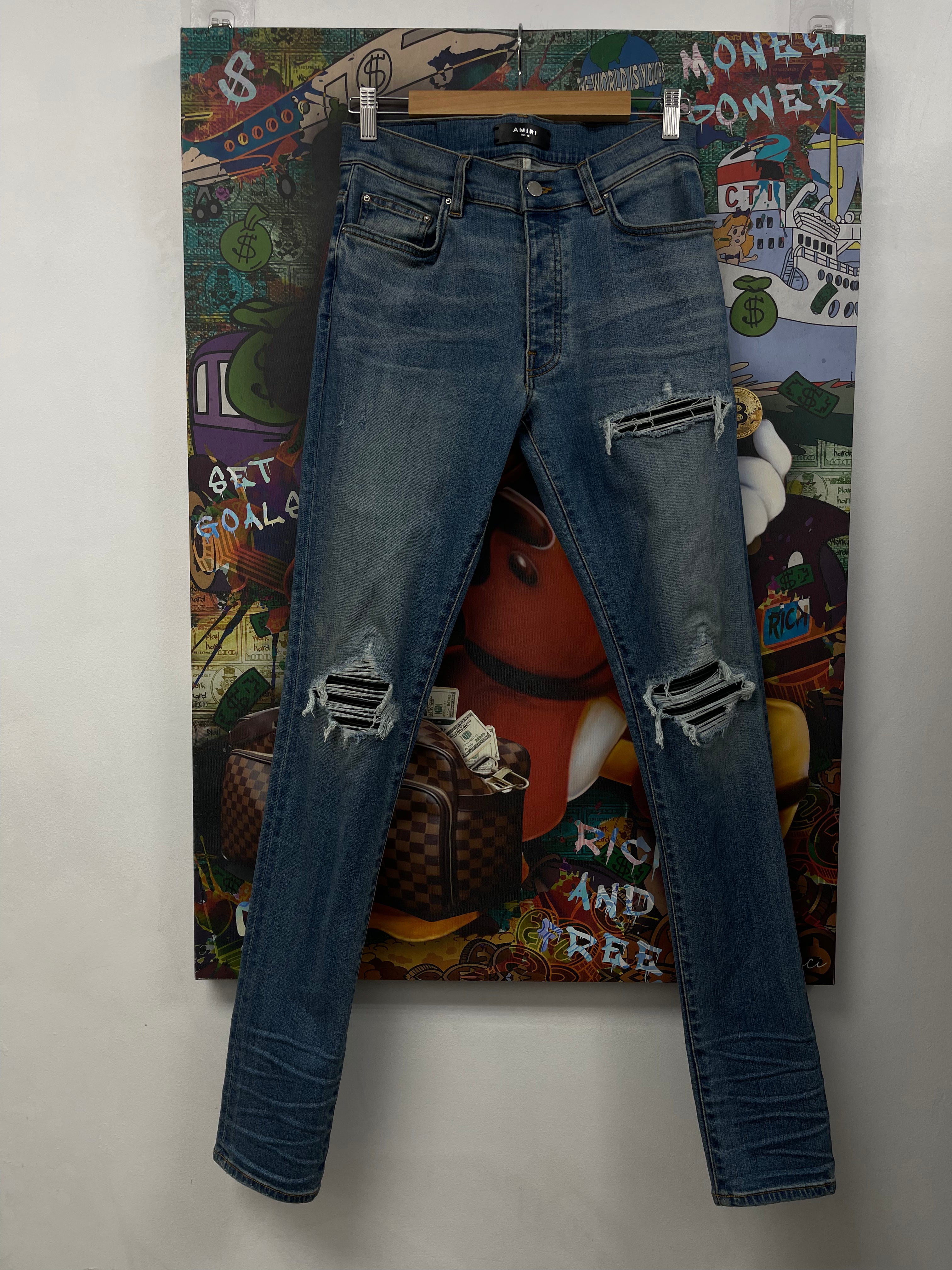 Amiri MX1 Light Wash Black Patch Jeans