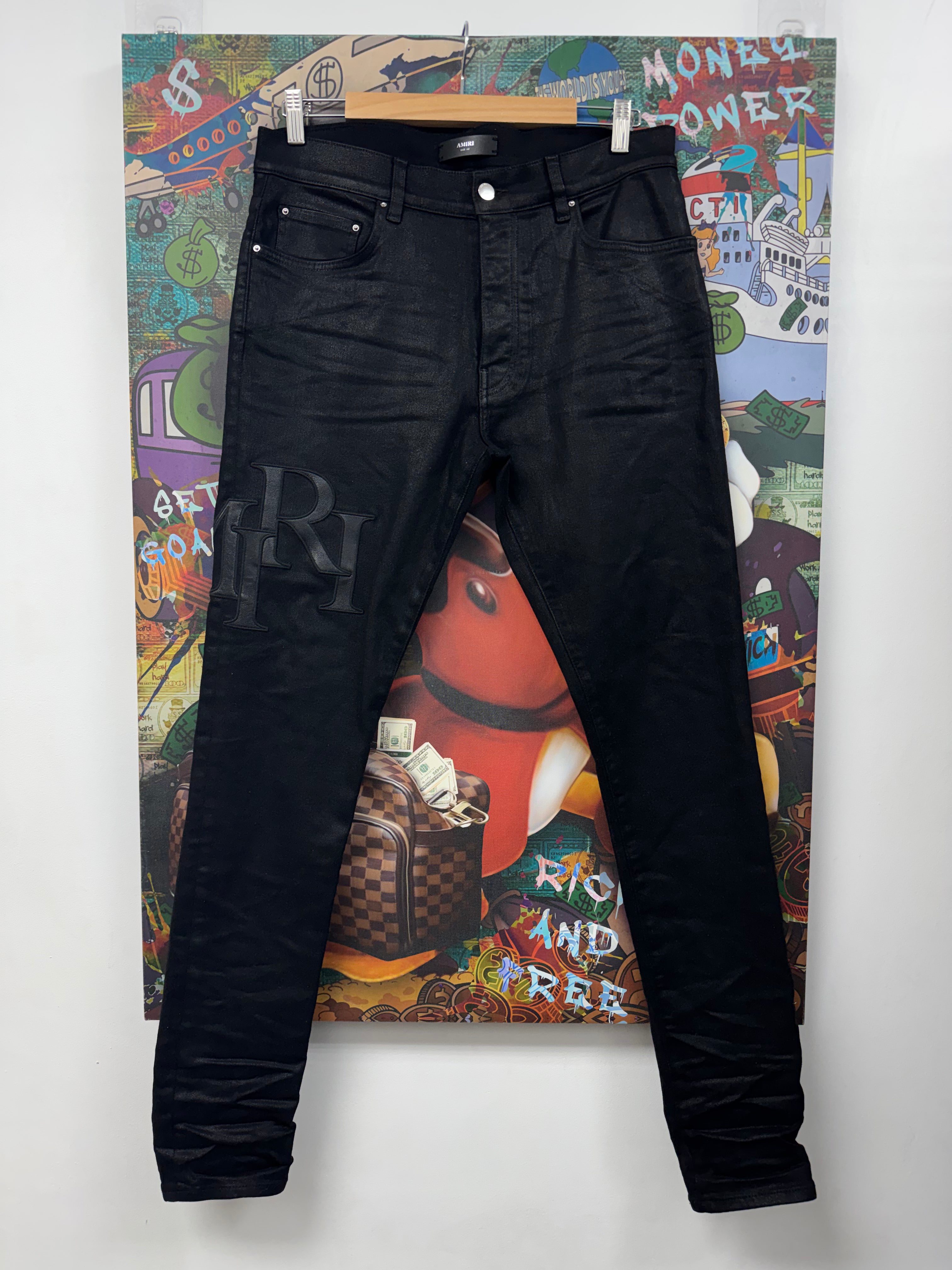 Amiri Black Wax Staggered Side Logo Jeans