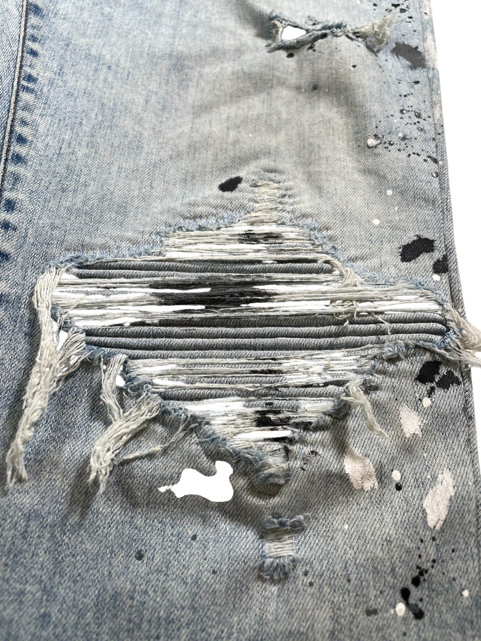 Amiri MX1 Paint Splatter Light Wash Jeans