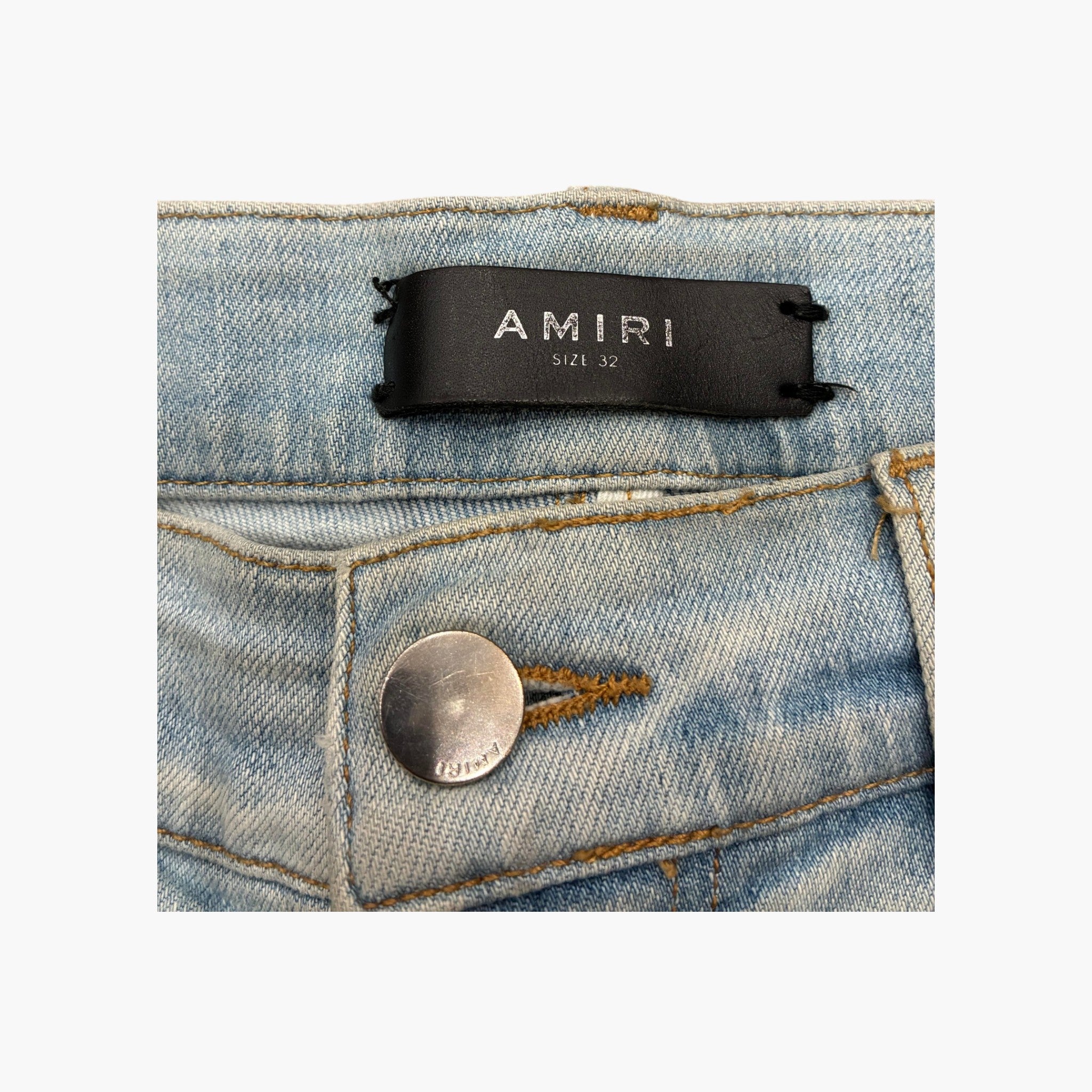 Amiri Ripped Thrasher Jeans