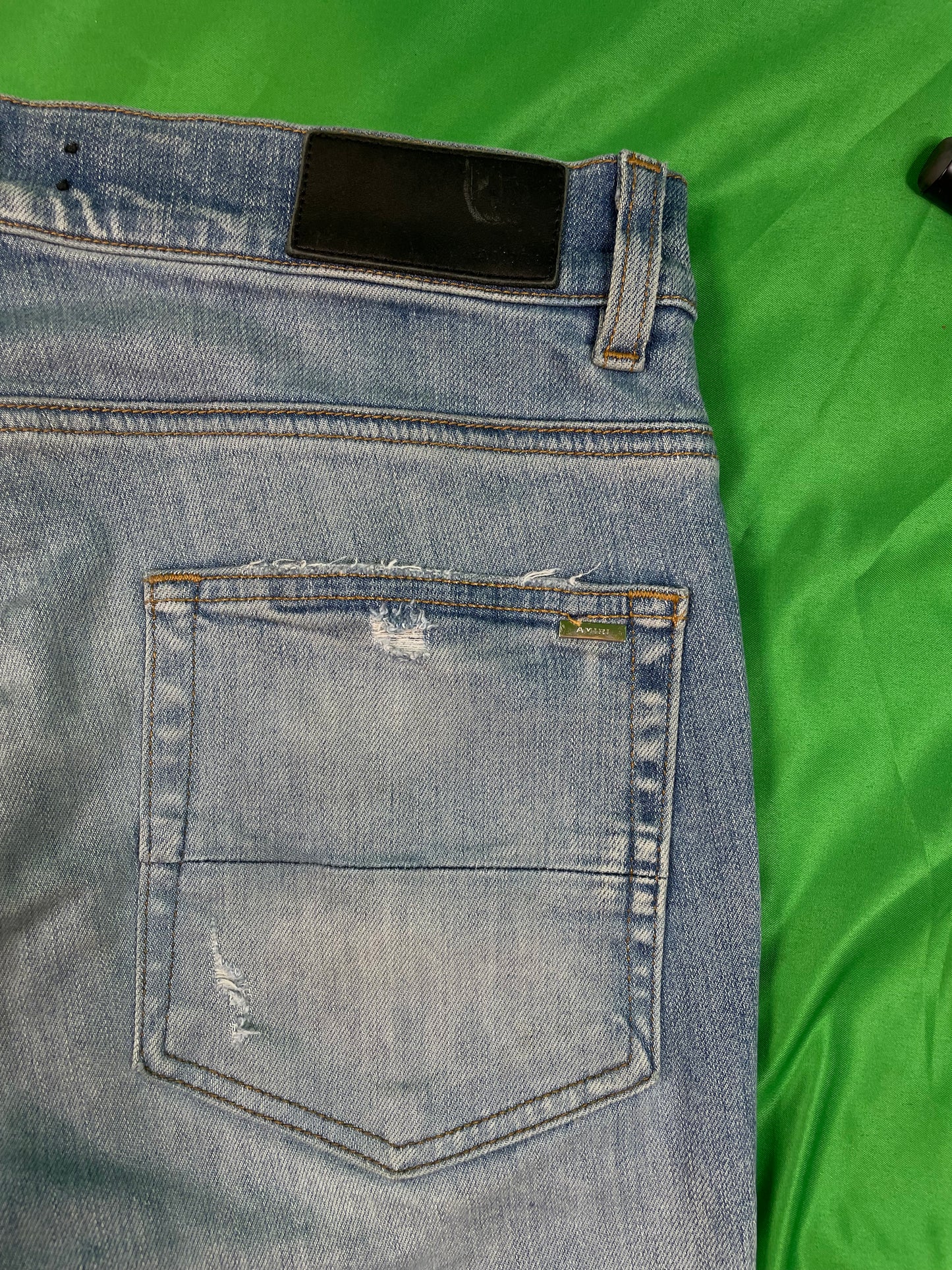 Amiri MX1 Orange Crackle Patch Light Wash Blue Jeans