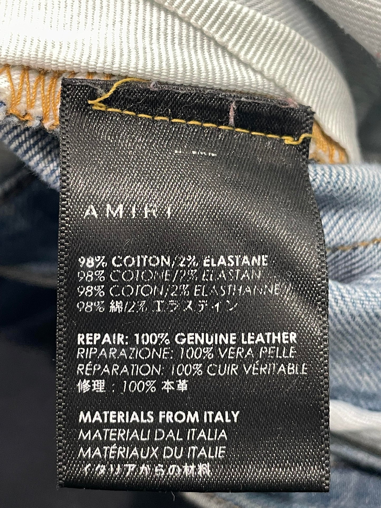 Amiri Mx1 Light Wash Black Patch Jeans