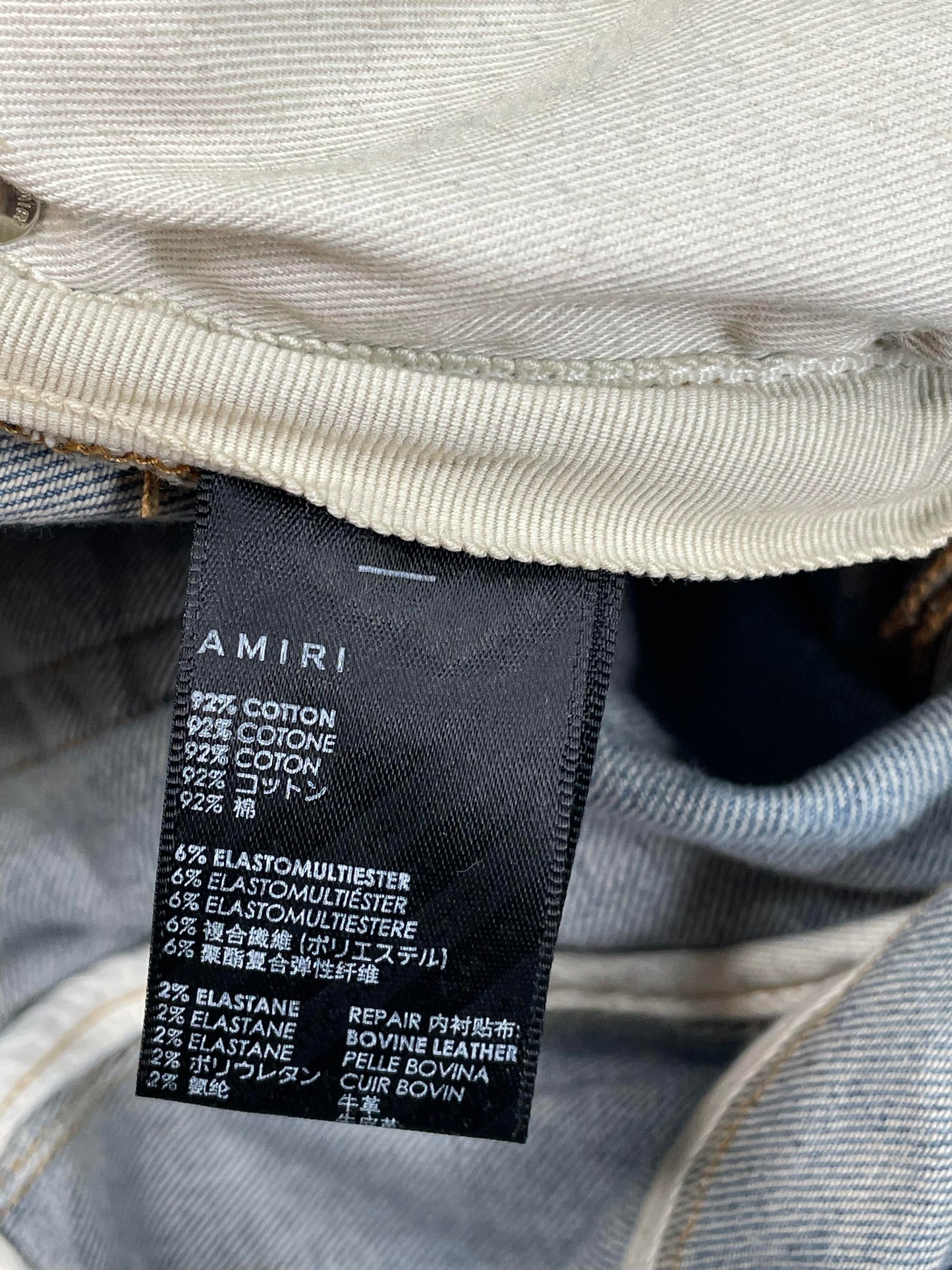 Amiri MX1 Light Wash Orange Crackle Jeans