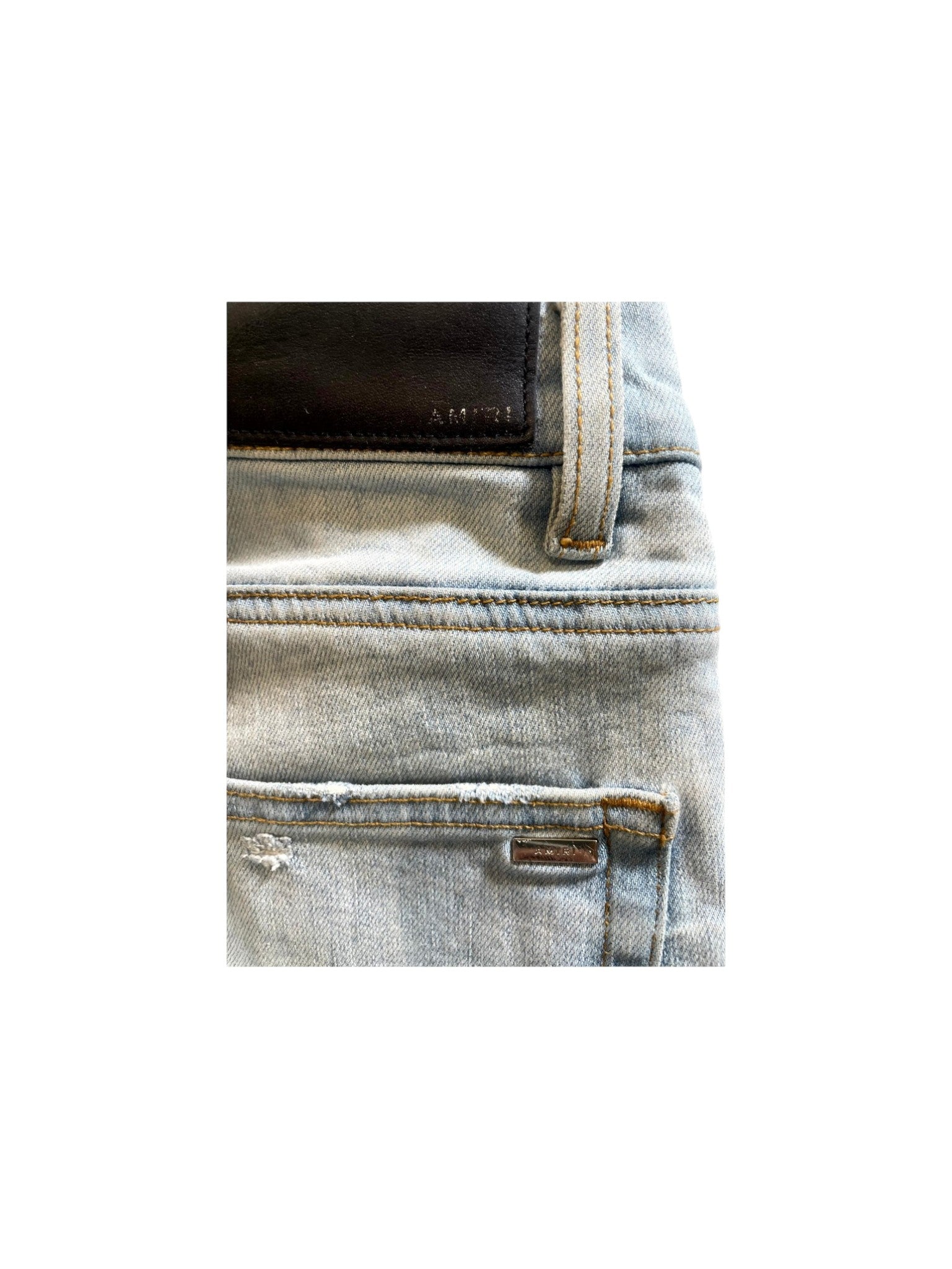 Amiri Ripped Light Wash Jeans