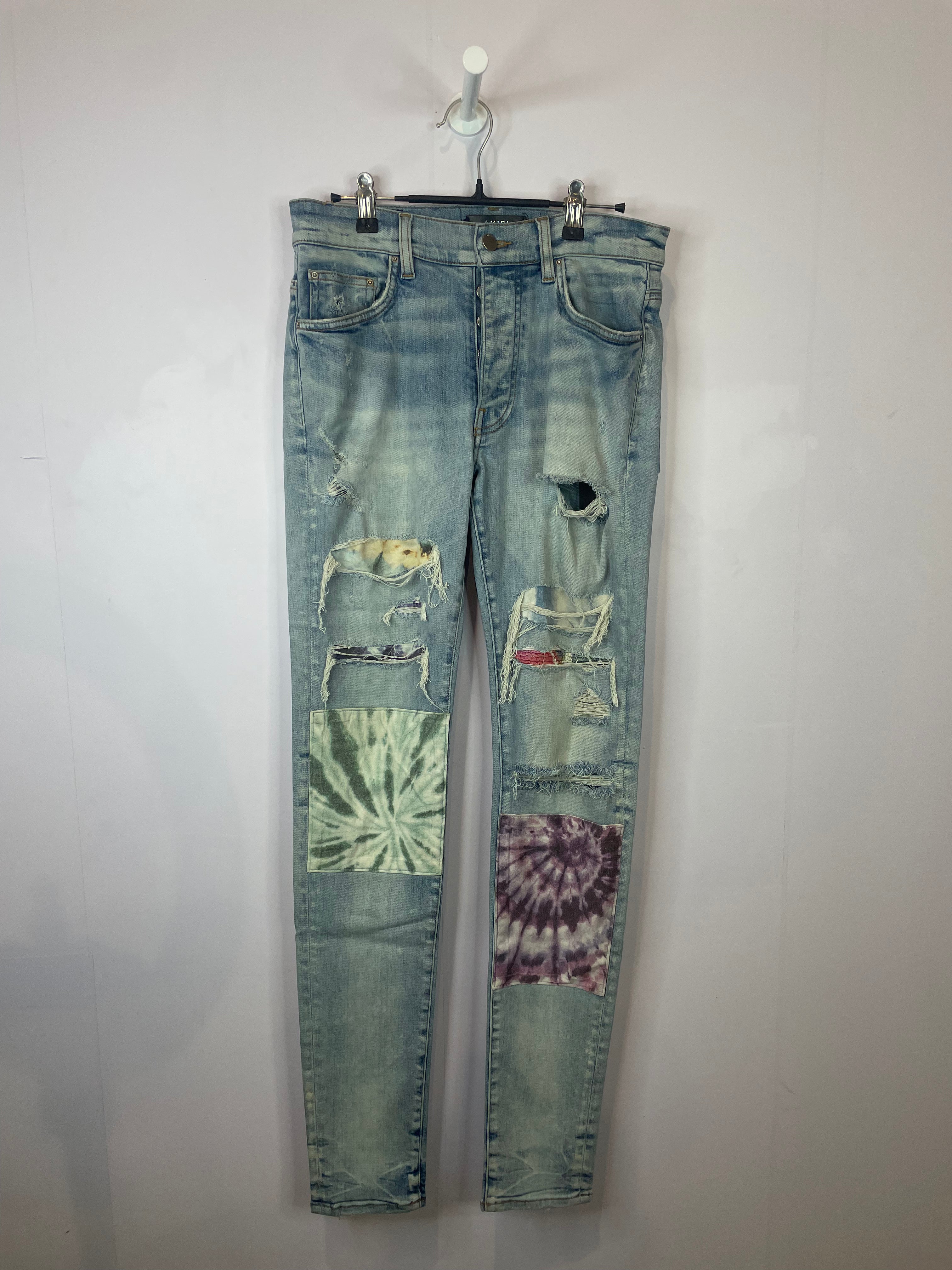 Amiri Light Wash Tie Dye Patch Blue Jeans