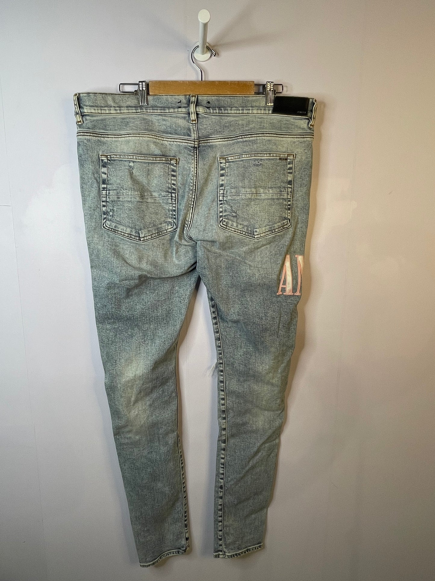 Amiri Pink Side Logo Light Wash Blue Jeans