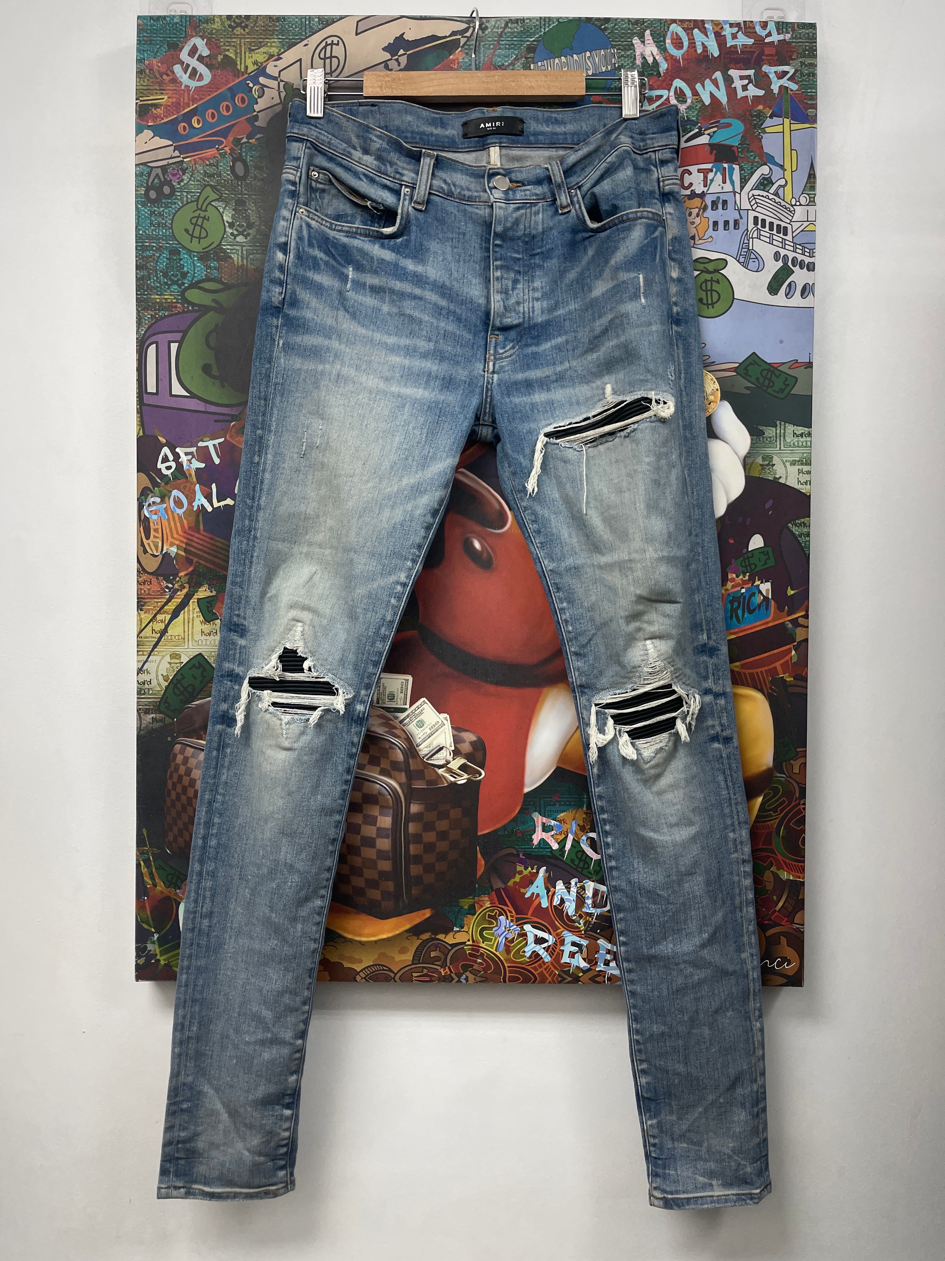 Amiri MX1 Light Wash Black Leather Patch Jeans