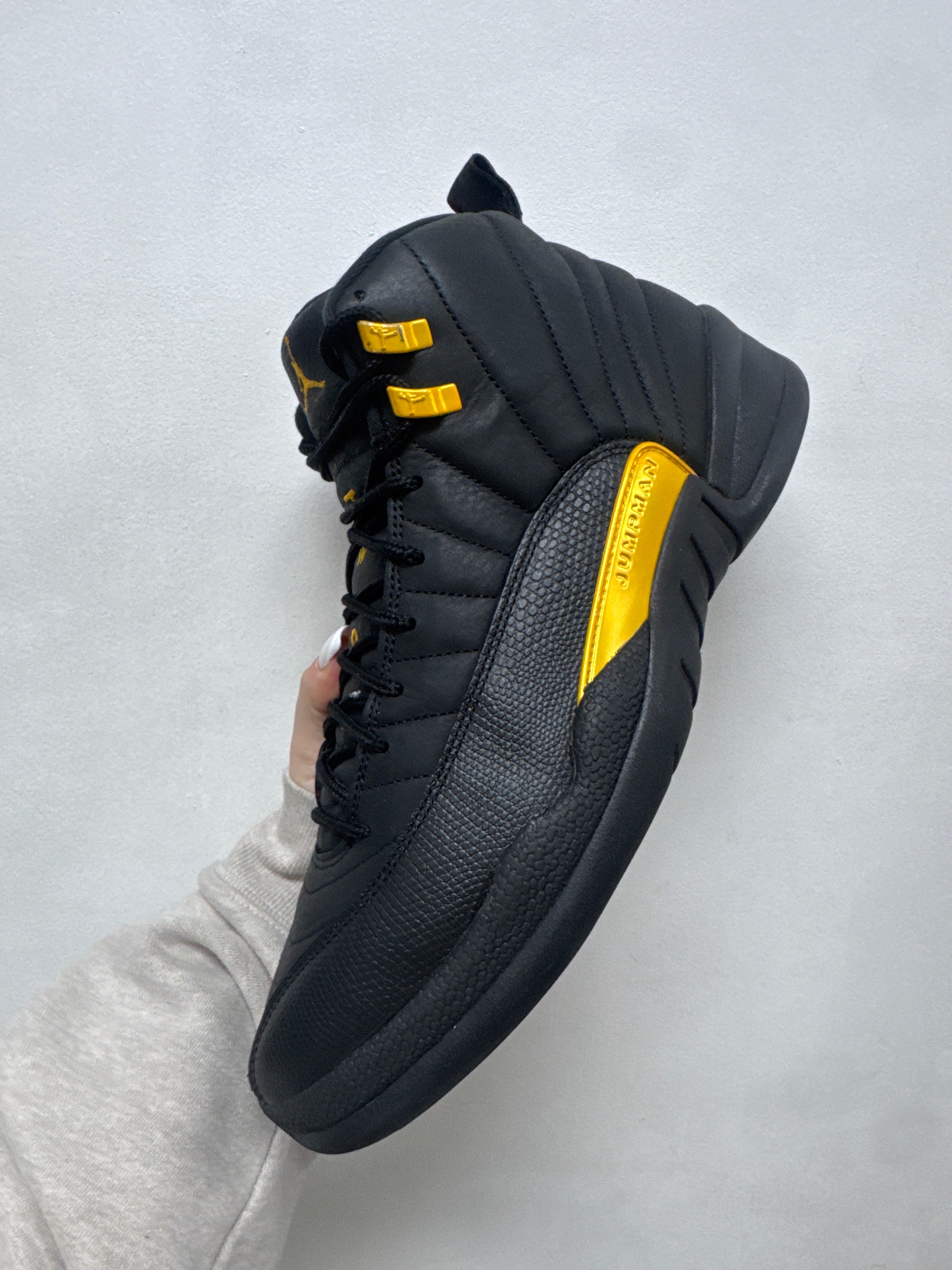 Jordan 12 Black Taxi Sneakers