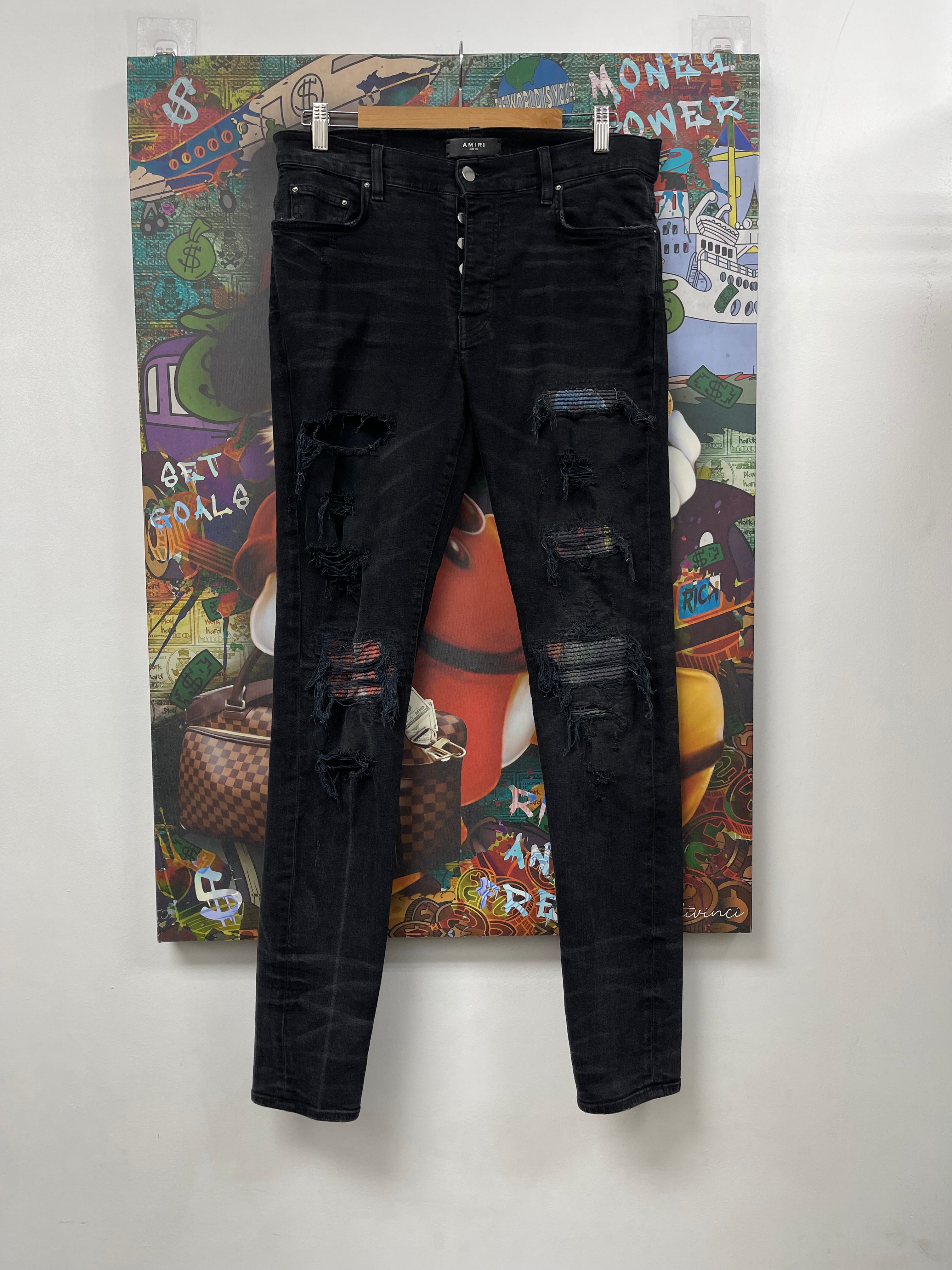 Amiri MX1 Black Wash Animation Patch Jeans