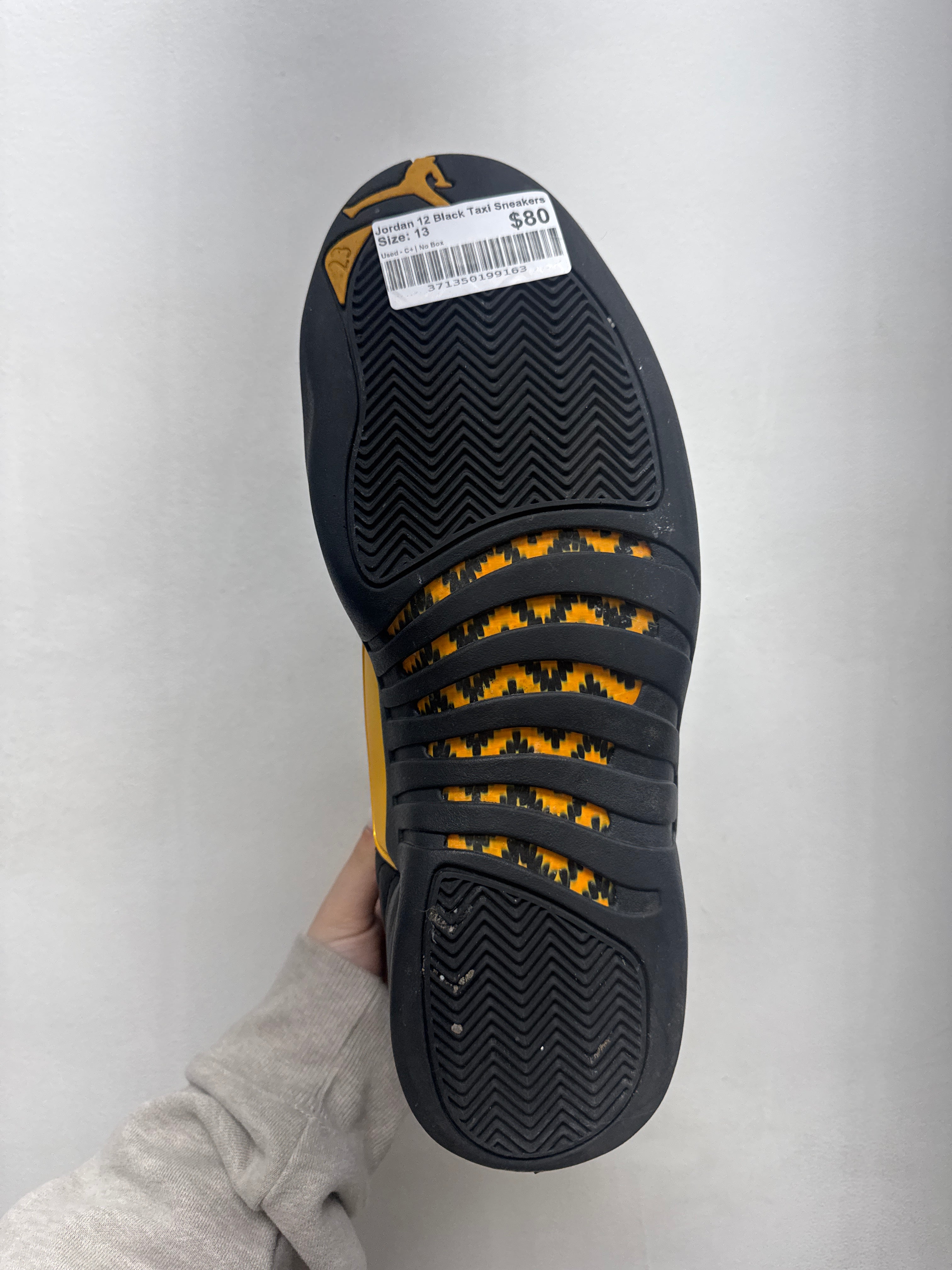 Jordan 12 Black Taxi Sneakers
