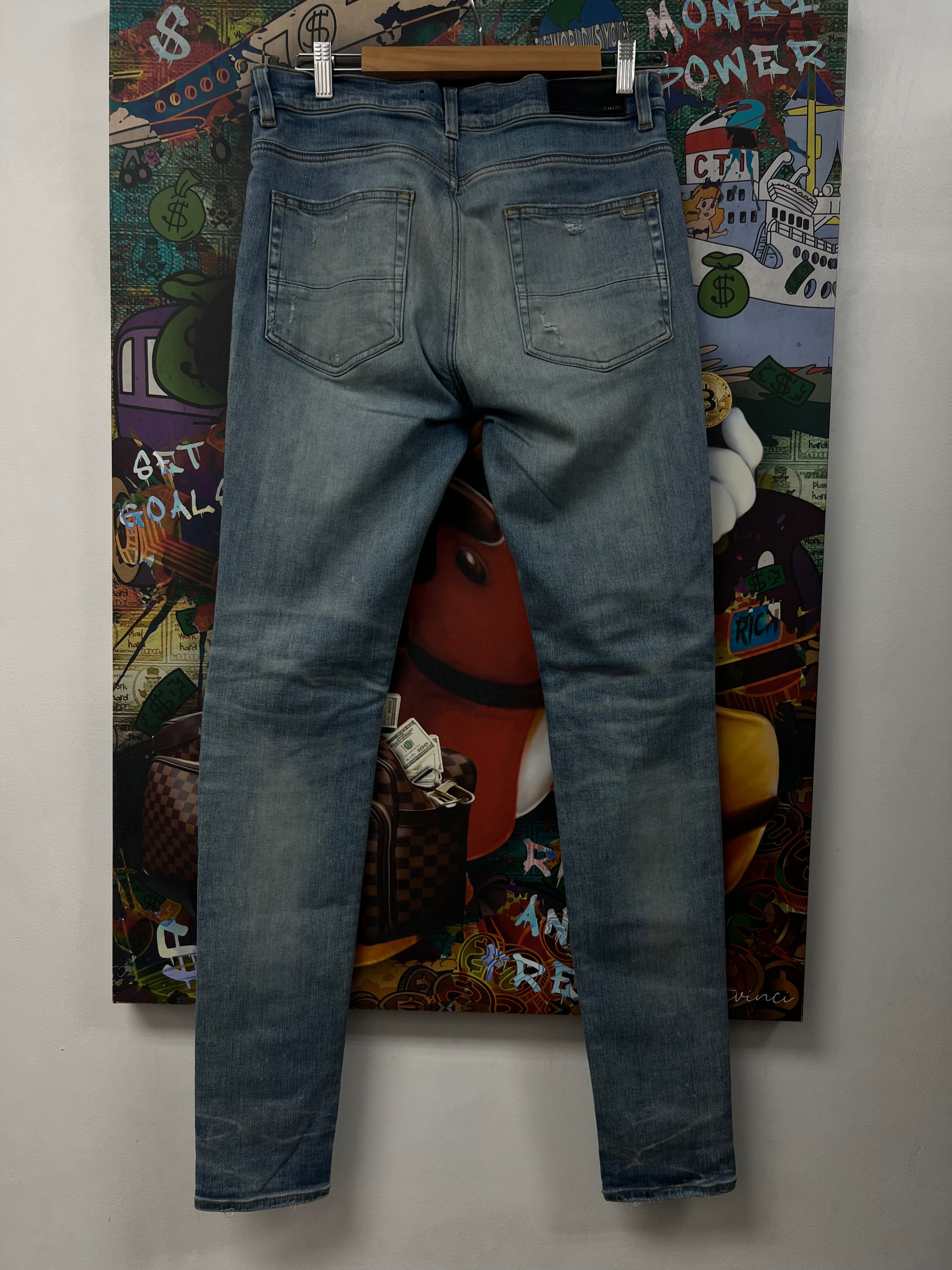 Amiri MX1 Light Wash Orange Crackle Jeans