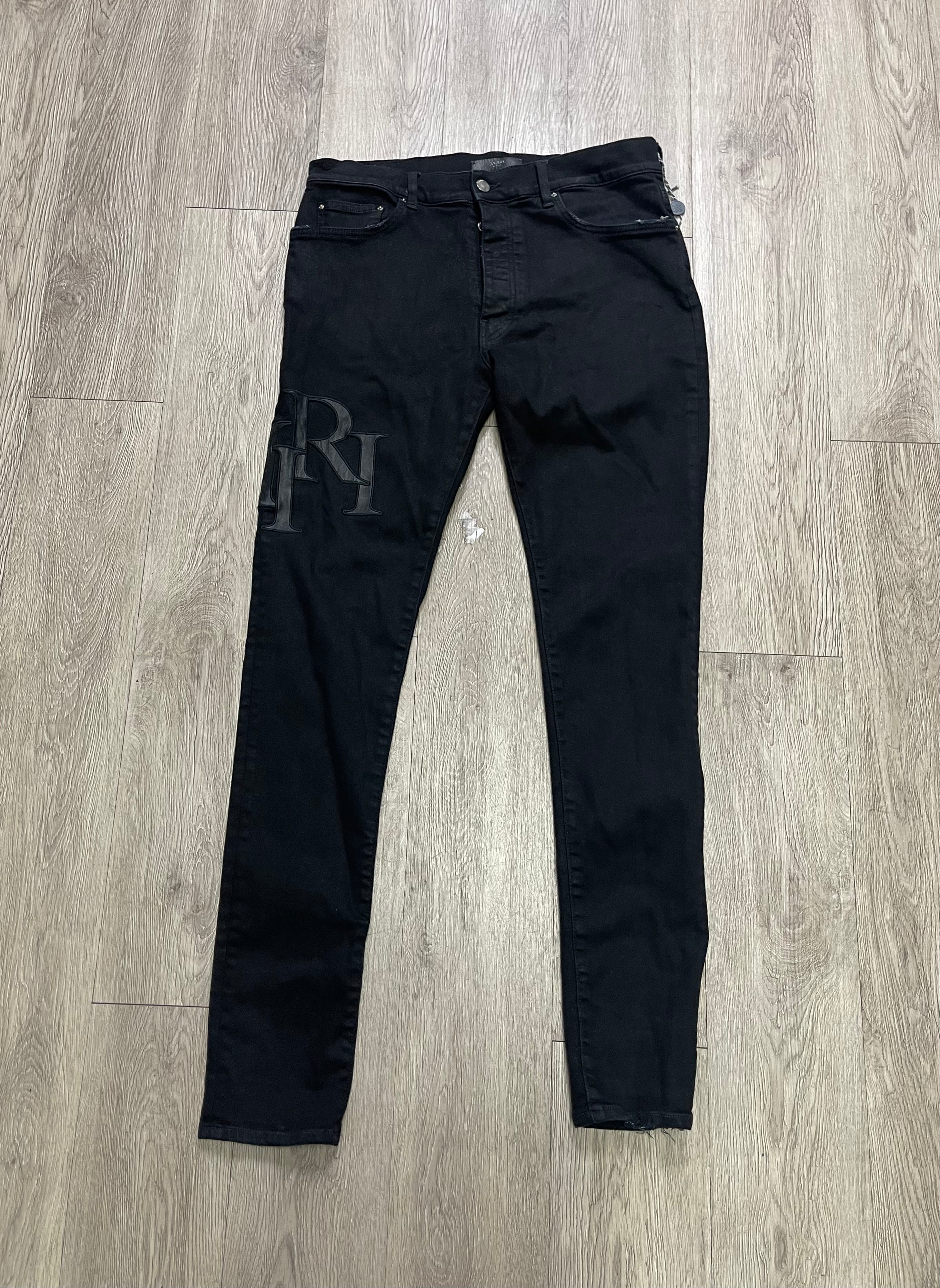 Amiri Black Wax Staggered Side Logo Jeans