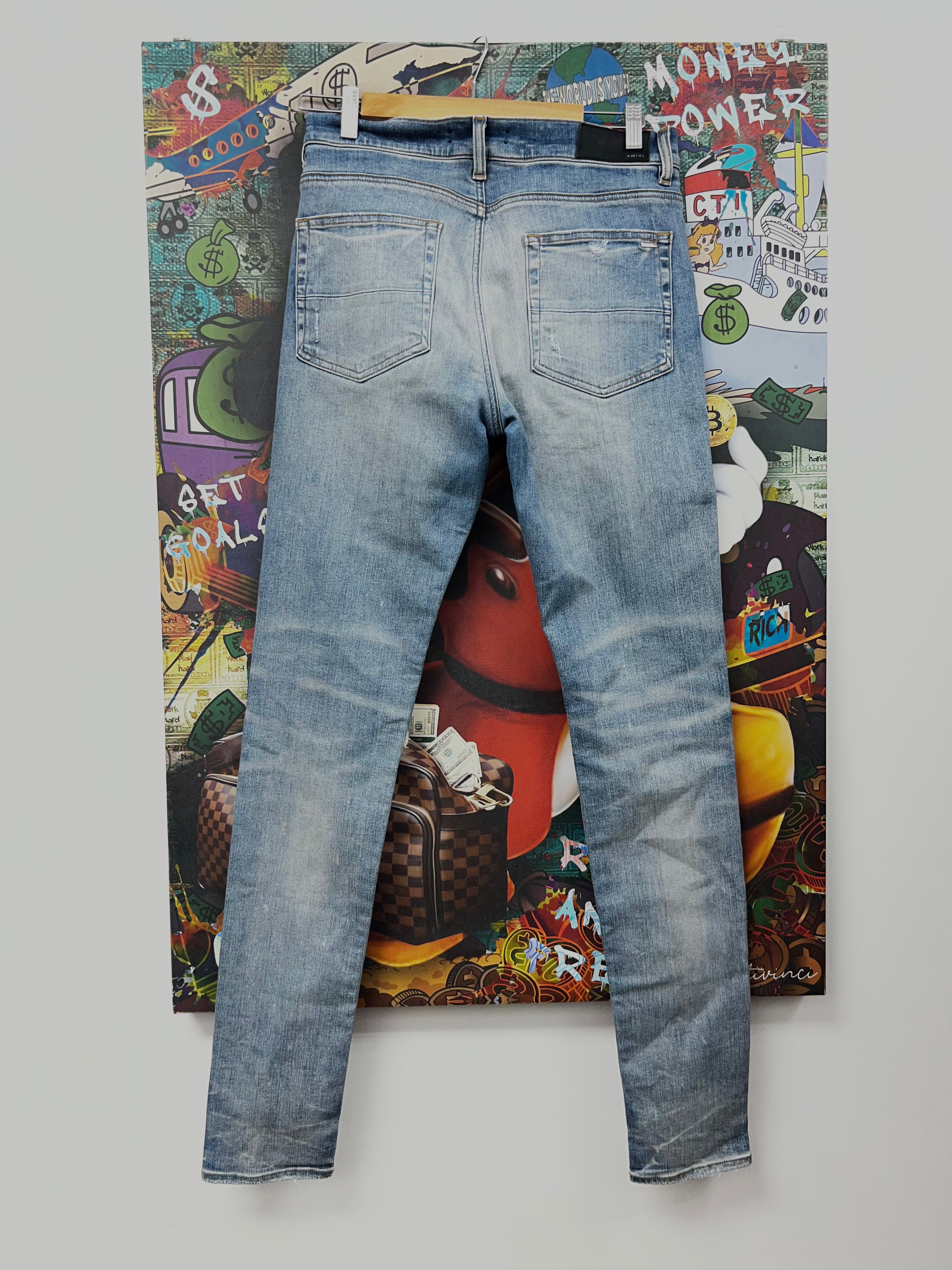 Amiri MX1 Light Wash White Suede Patch Jeans