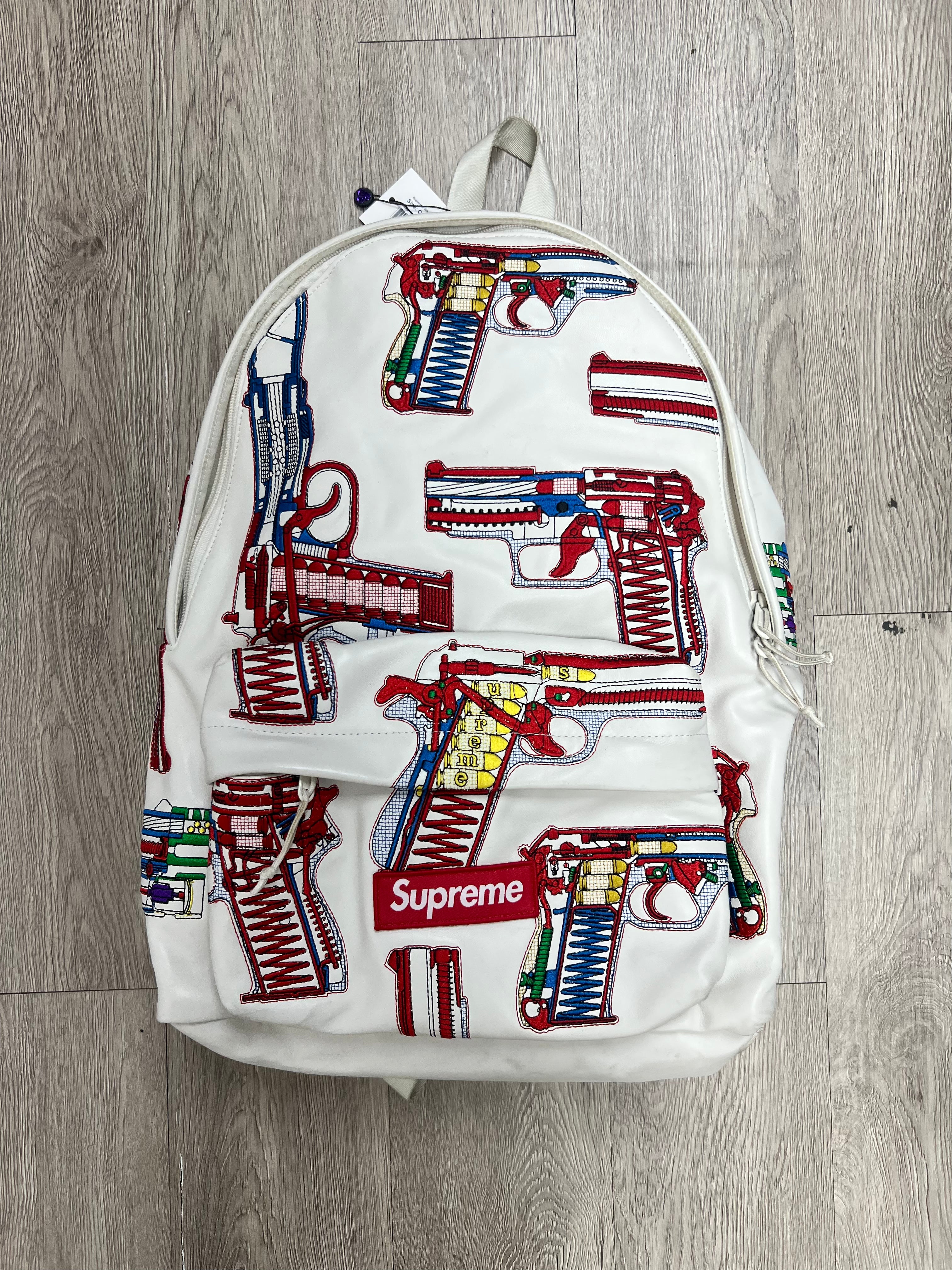 Supreme White Embroidered Guns Backpack