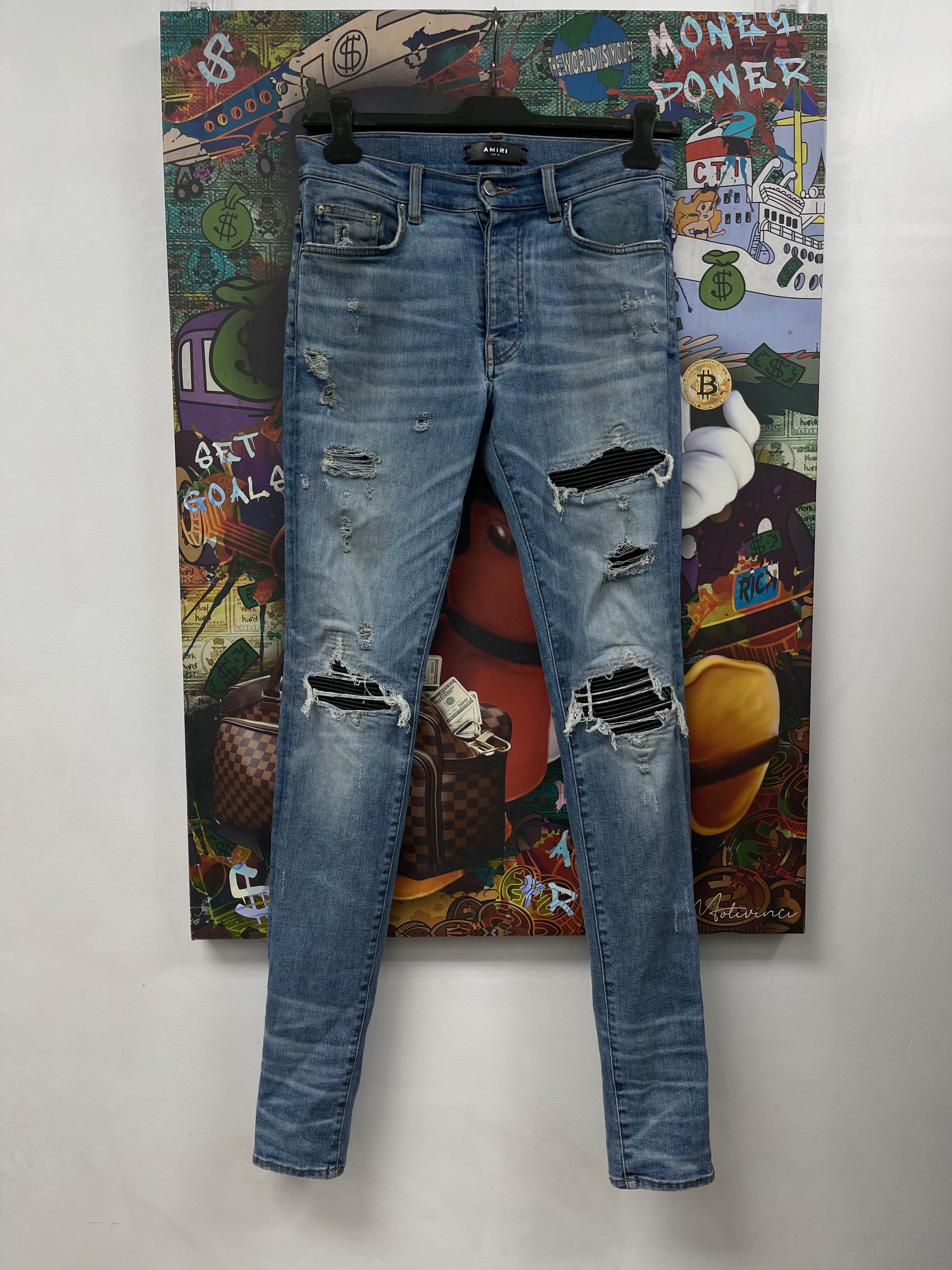 Amiri MX1 Light Wash Black Patch Jeans