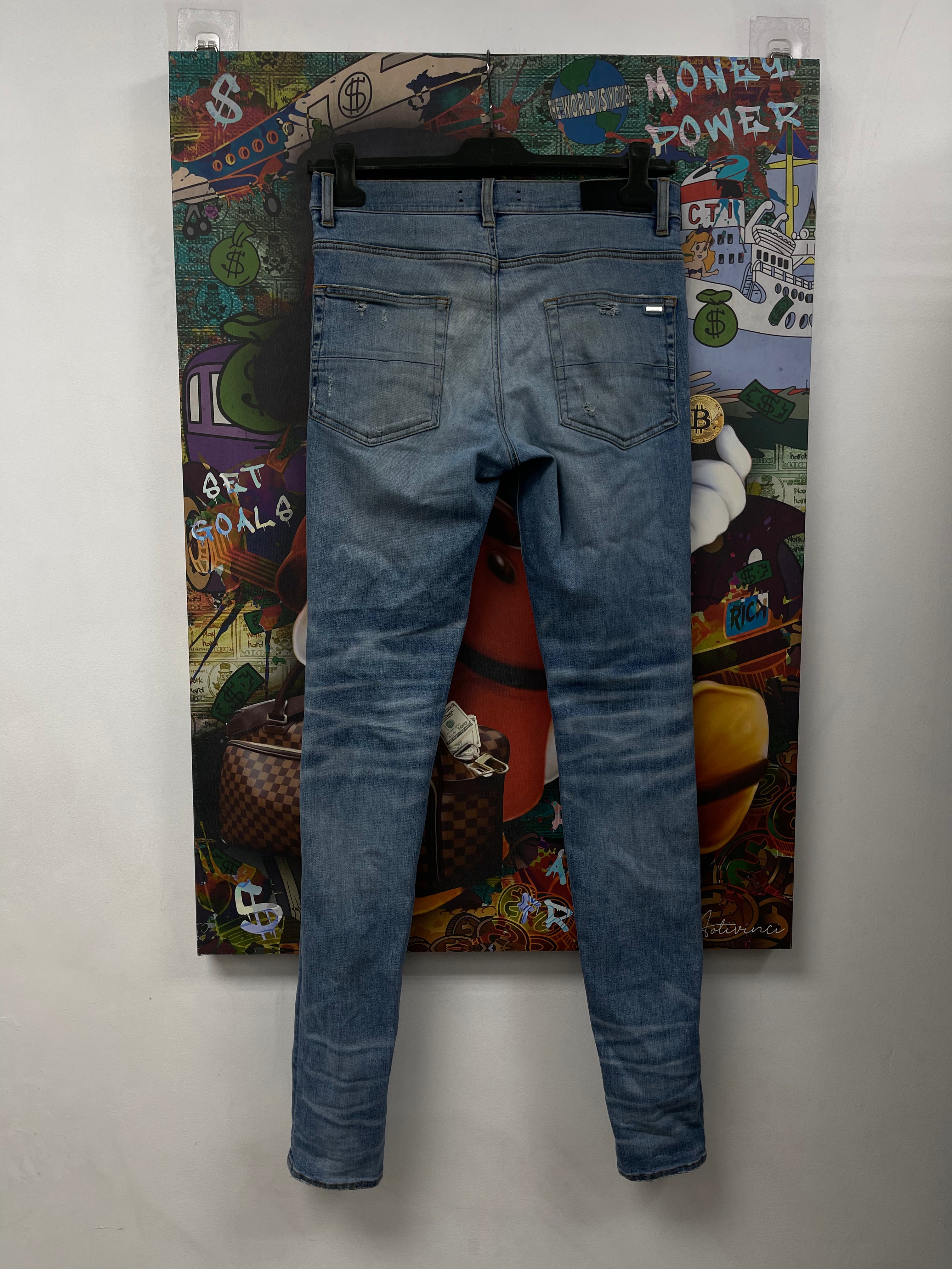 Amiri MX1 Light Wash Black Patch Jeans
