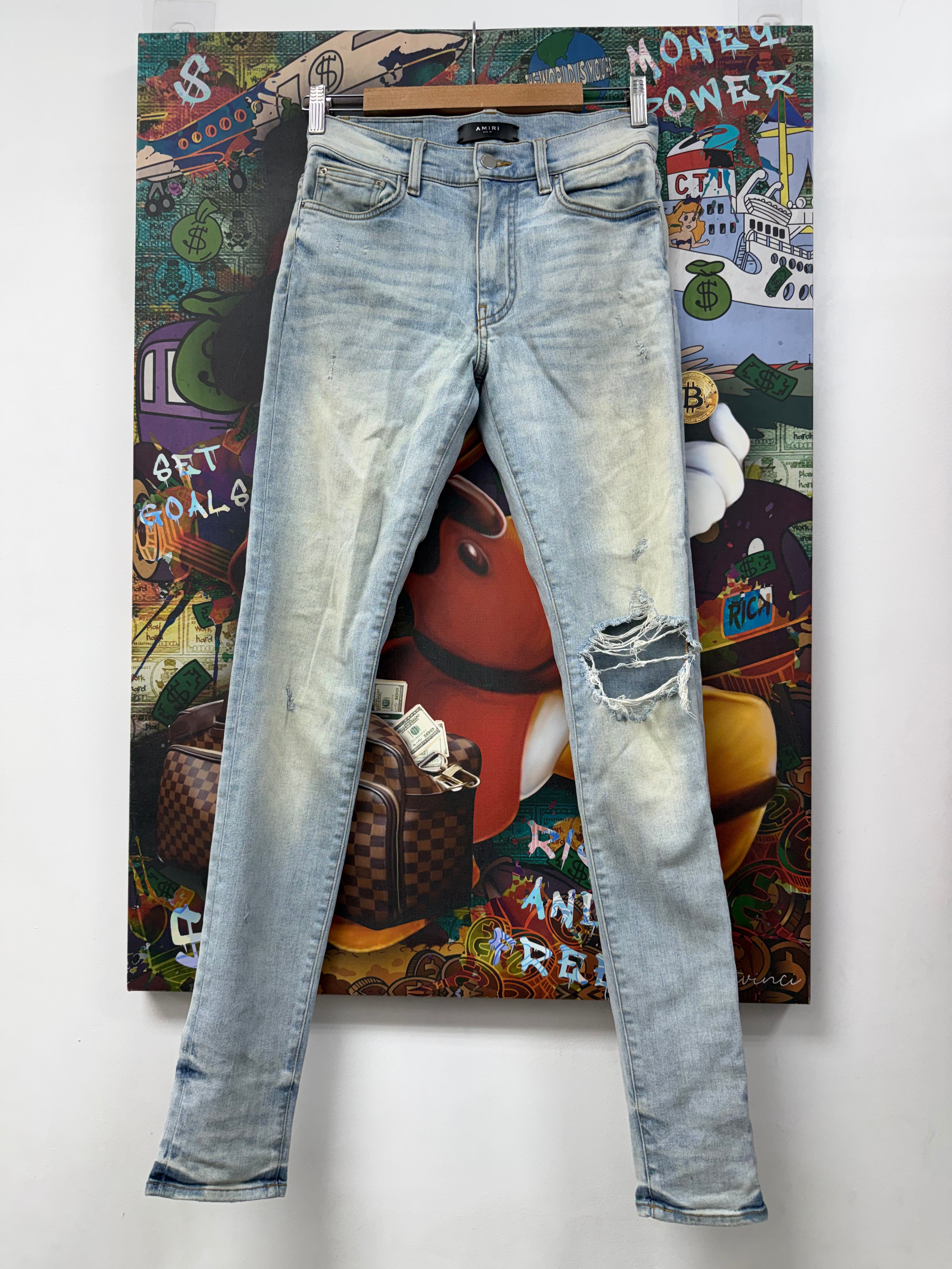 Amiri Light Wash Knee Rip Jeans