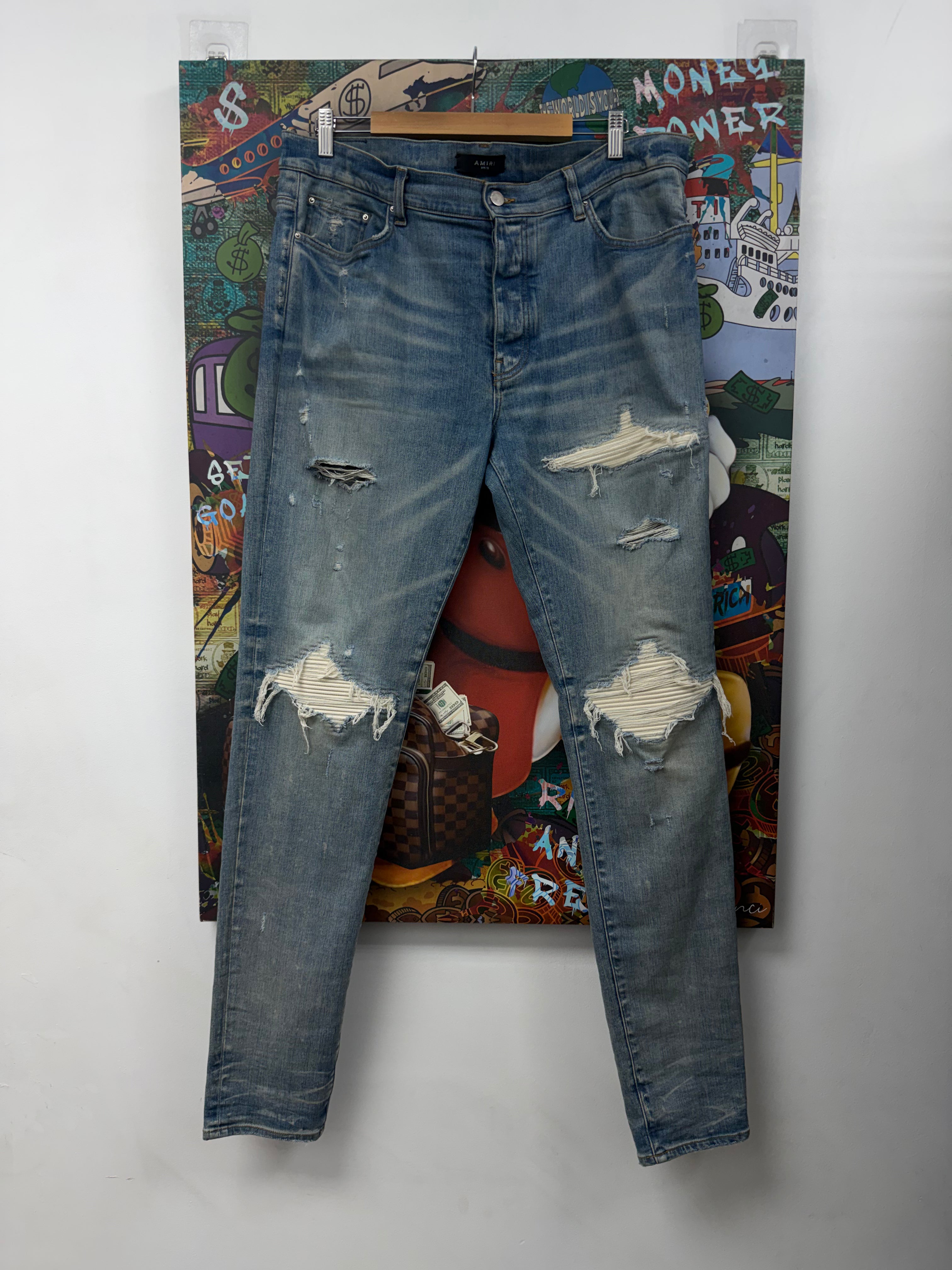 Amiri MX1 Light Wash White Suede Patch Jeans